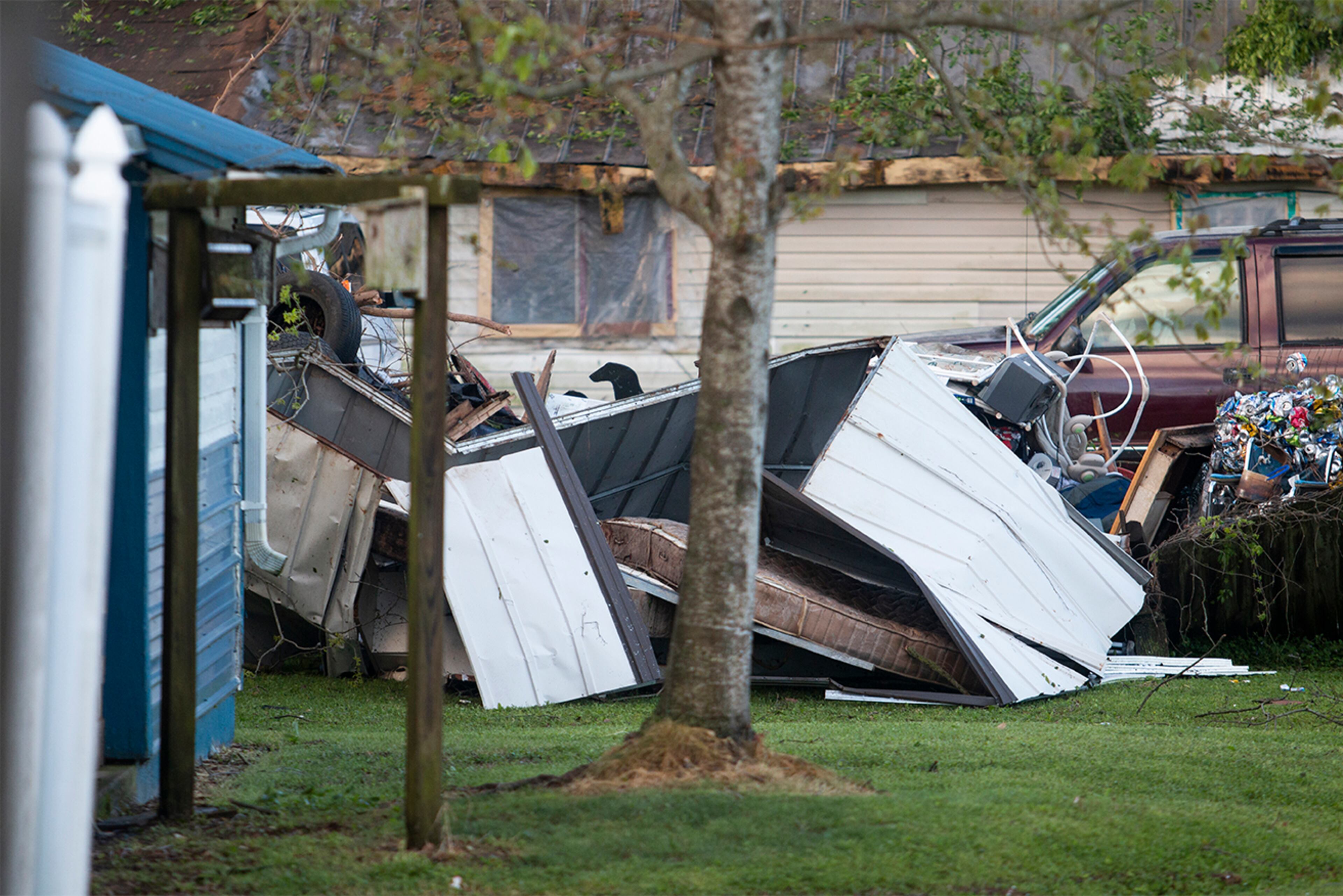 13.04.20 Debris from neighboring houses lands in a back yard after a tornado ripped through Chatooga county. Photo by Matthew McConnell