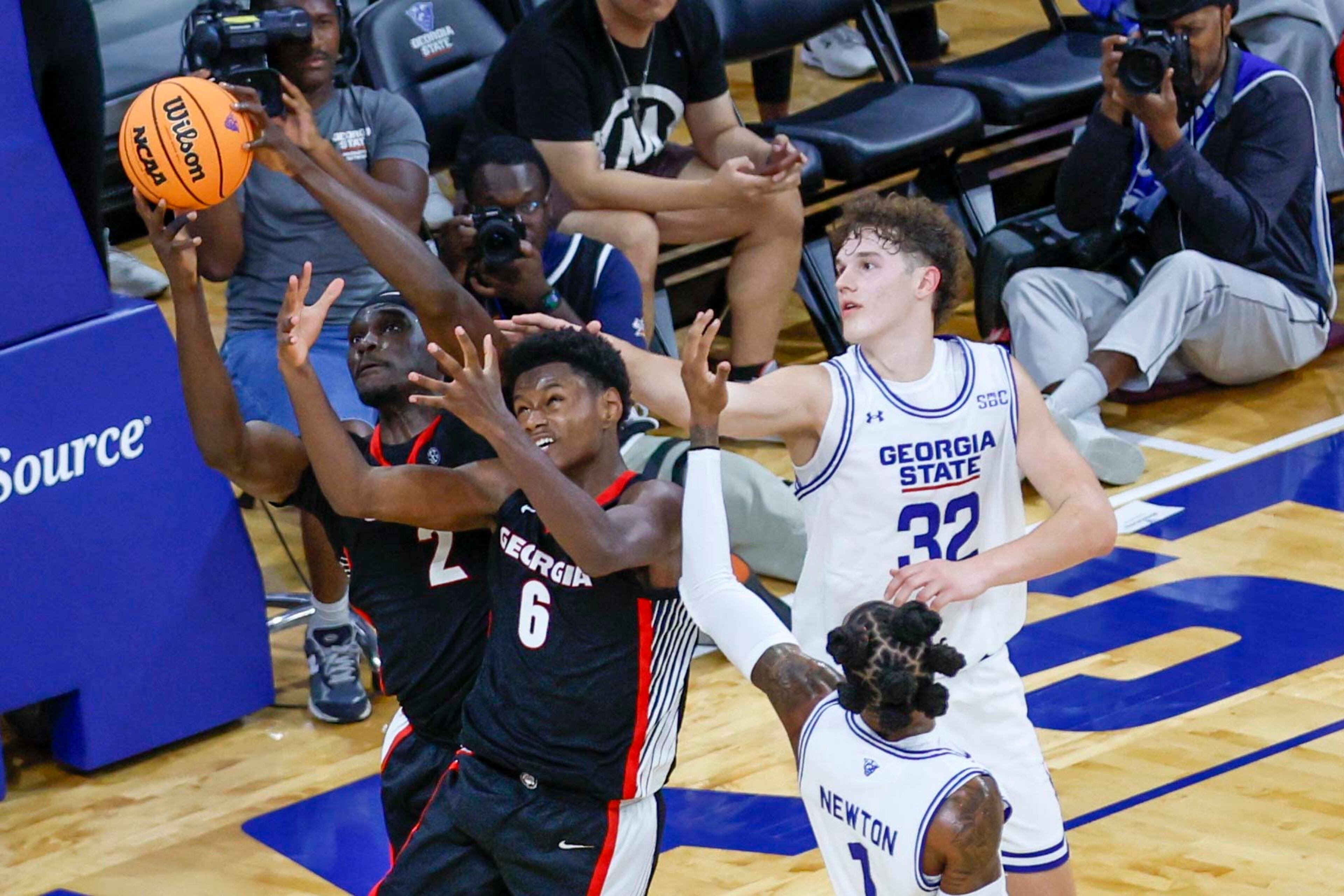 Georgia Bulldogs forward Kanon Catchings (6) and Georgia Bulldogs center Somtochukwu Cyril (2) fight for possession against Georgia State Panthers center Christian Beam (32) during the second half of an exhibition opener game at the Georgia State Convocation Center, Wednesday, October 15, 2025, in Atlanta. (Miguel Martinez/ AJC)