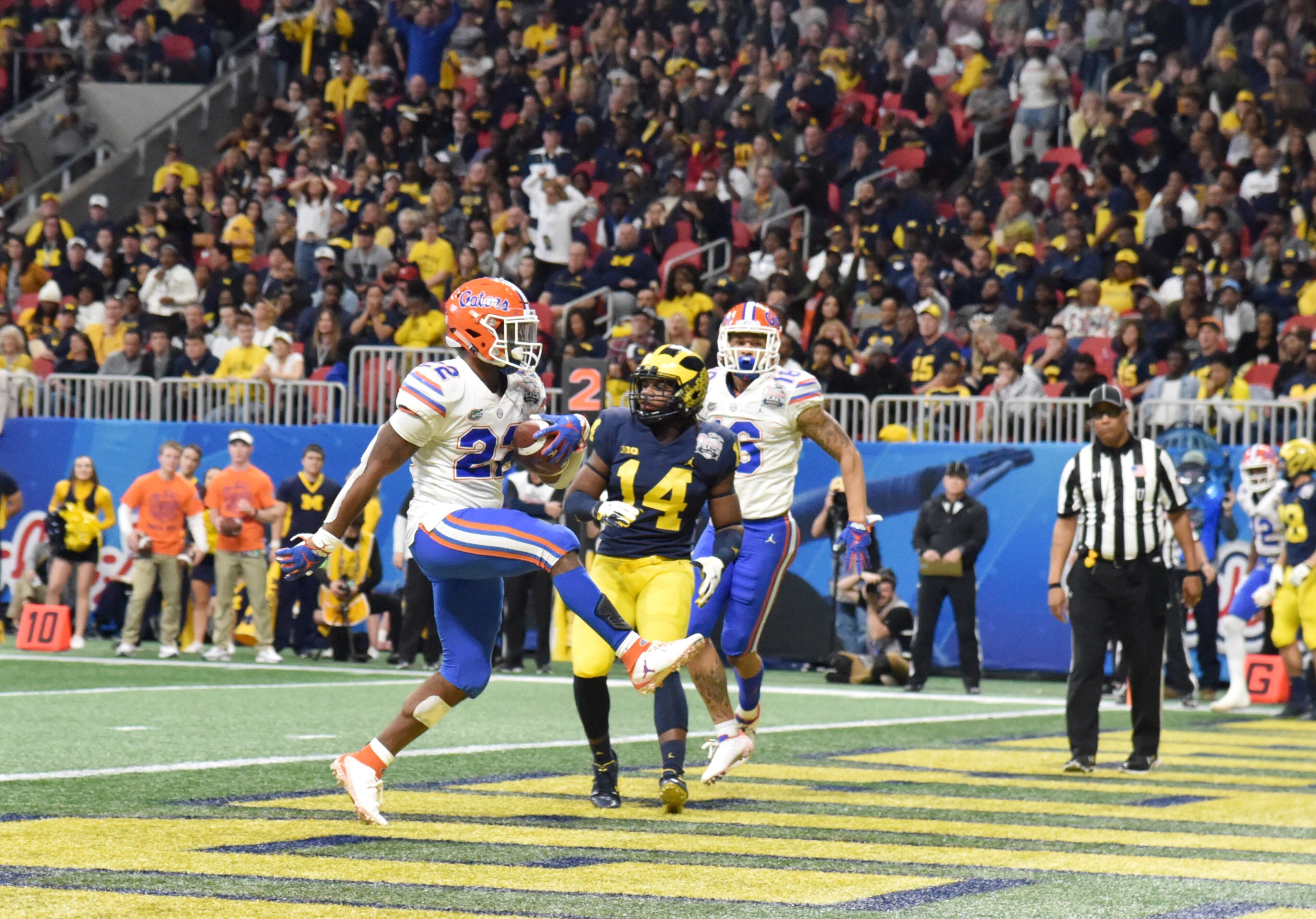 December 29, 2018 Atlanta - Florida Gators running back Lamical Perine (22) celebrates as he scores a touchdown in the second half of the Chick-fil-A Peach Bowl at Mercedes-Benz Stadium on Saturday, December 29, 2018. Florida Gators won 41-15 over the Michigan Wolverines. HYOSUB SHIN / HSHIN@AJC.COM