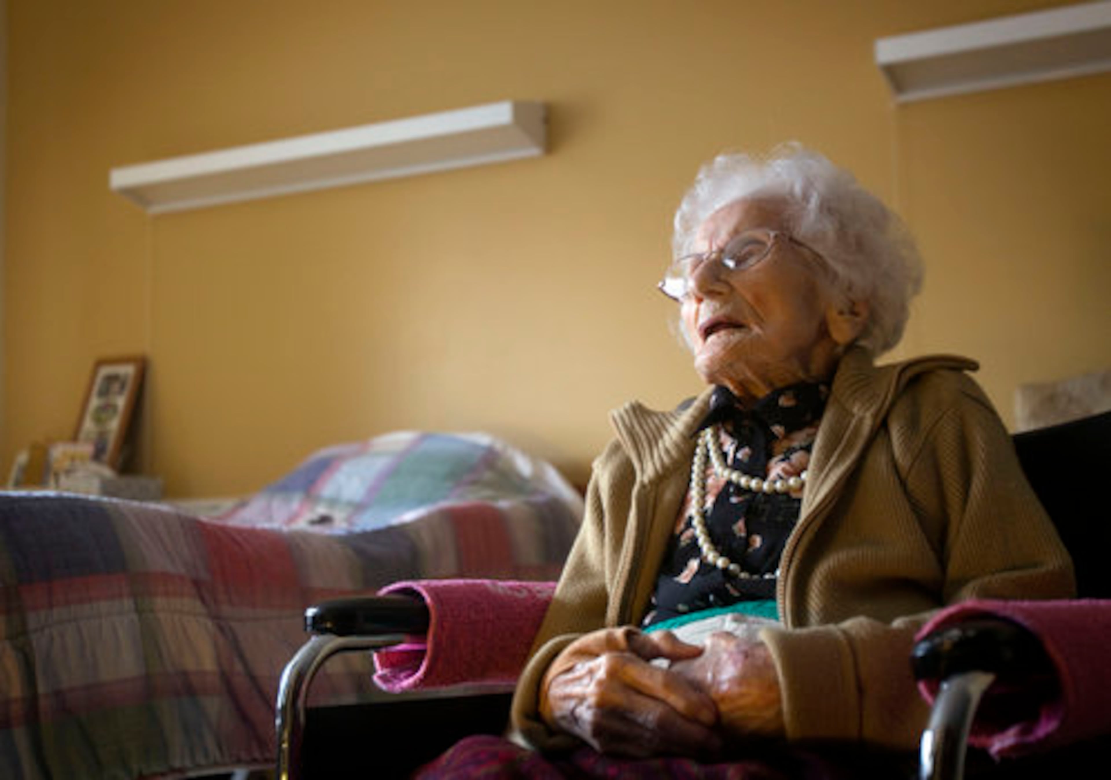 Besse Cooper, who at 114 years and five months old, is the world's oldest person according to the Los Angeles-based Gerontology Research Group, sits in her room at a nursing home Tuesday, Feb. 1, 2011, in Monroe, Ga. She died in a nursing home on Tuesday, Dec. 4, 2012 She was 116.