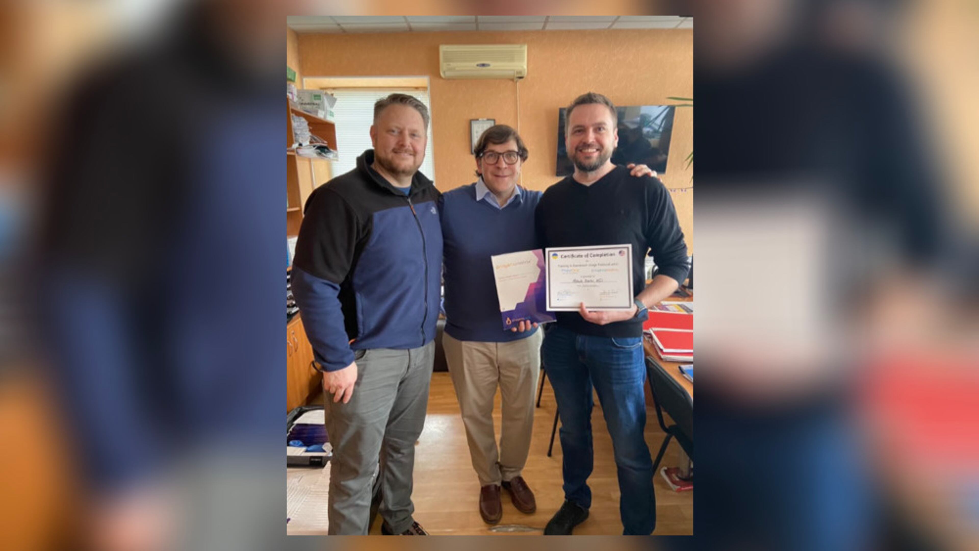 Pictured are Kristopher Perkins, managing director of PhaseOne Health, John Daniel, co-founder of ProgenaCare Global and Dr. Mitsuk Serhii, a Ukrainian surgeon. Courtesy HelpingUkraine.US