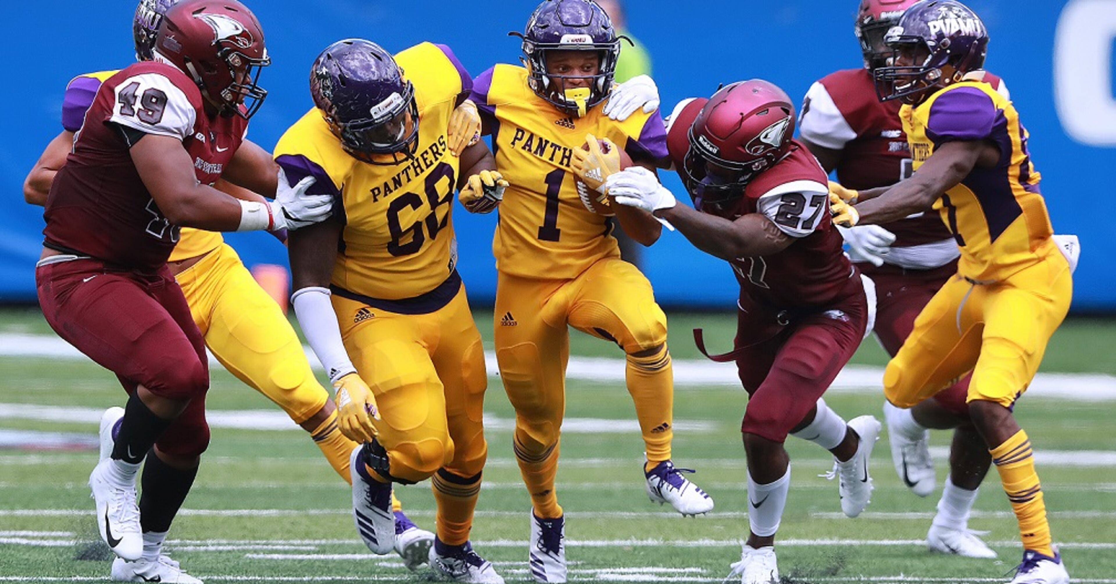 Prairie View A&M running back Dawonya Tucker picks up yardage against North Carolina Central defender Jaquell Taylor making the tackle during the first half of the MEAC-SWAC Challenge on Sunday, Sept 2, 2018, in Atlanta. Curtis Compton/ccompton@ajc.com