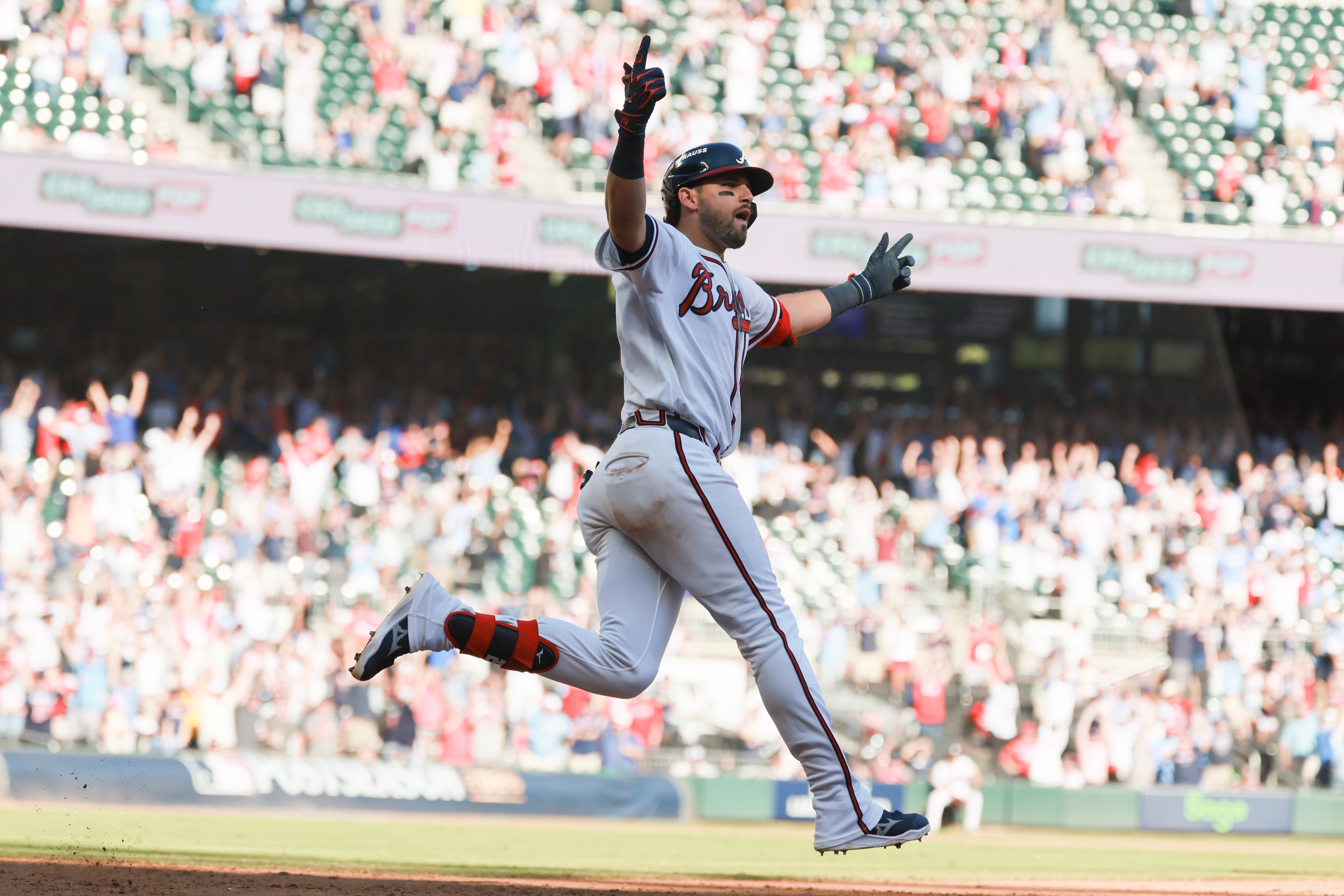 Atlanta BravesÕ Austin Riley reacts while rounding the bases after hitting a three-run home run against the Philadelphia Phillies during the eighth inning of Game 1 of a MLB National League Wild Card playoff series between the Atlanta Braves and the Philadelphia Phillies, Tuesday, Sept. 29, 2026, in Atlanta. (Jason Getz/AJC)