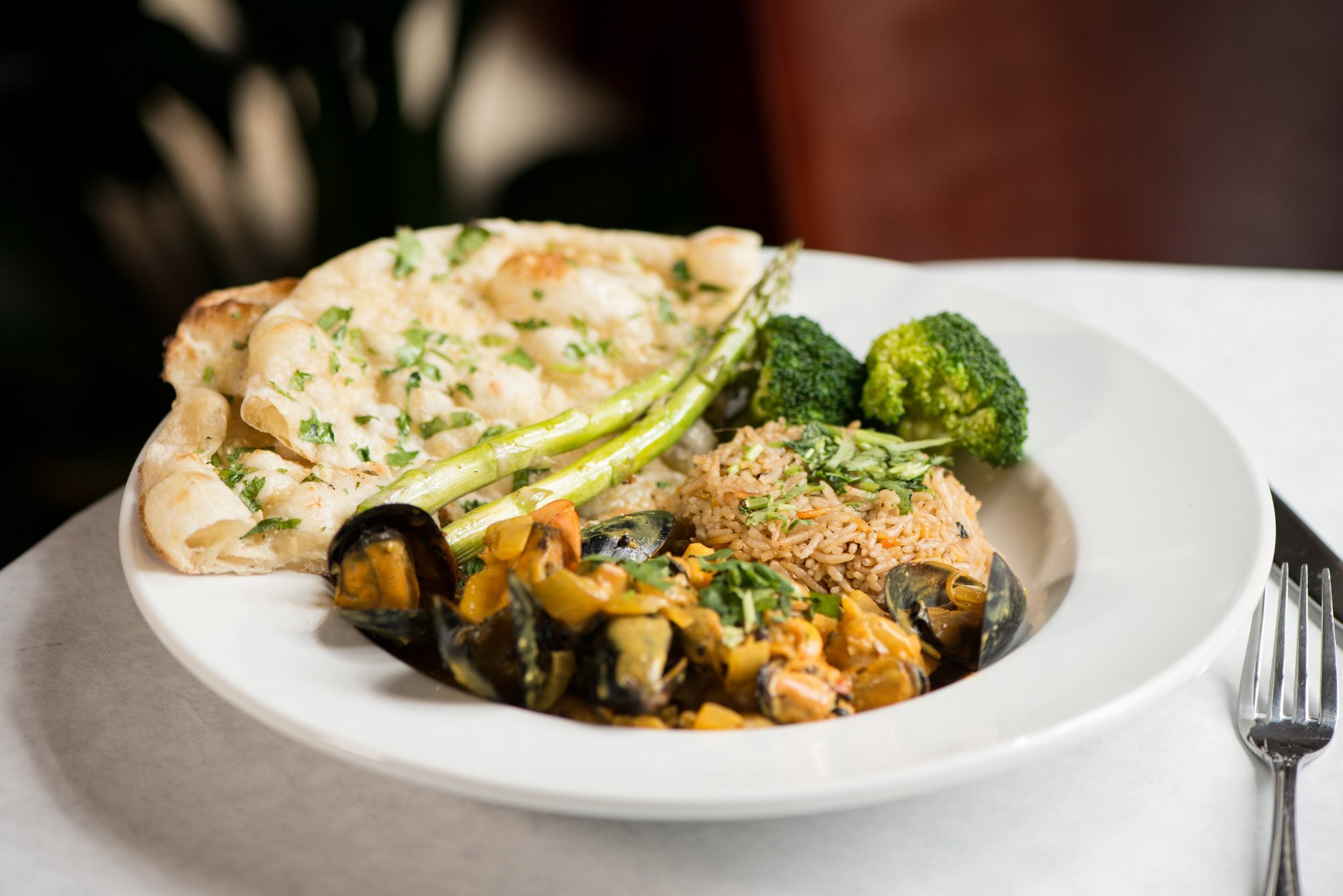 Seafood Symphony with shrimp, mussels, calamari, saffron, coconut and turmeric. Photo credit- Mia Yakel.