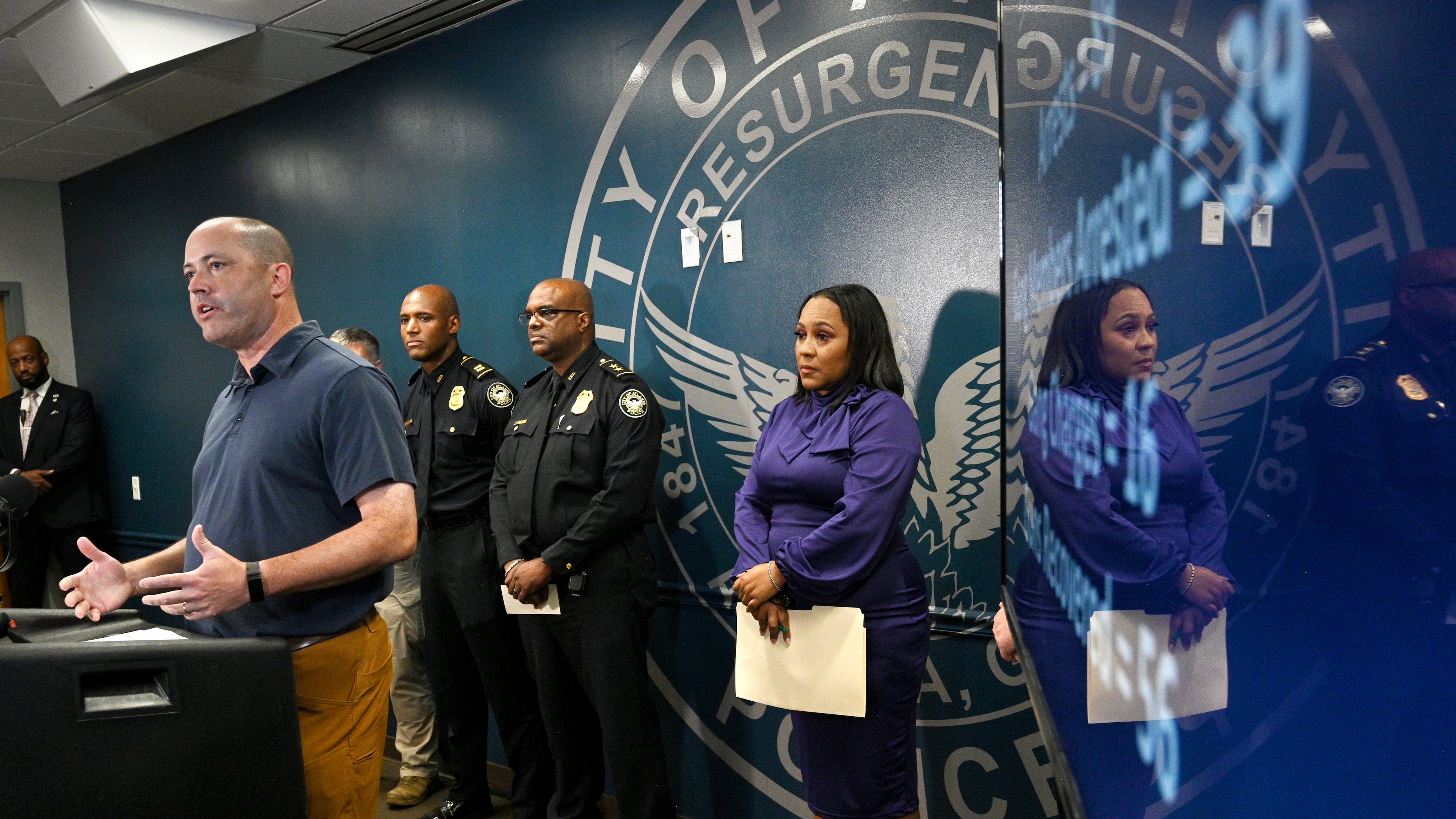 Georgia Attorney General Chris Carr speaks as Fulton County District Attorney Fani Willis (right) and other officials stand behind during a news conference on Operation Heatwave at APD Public Safety Headquarters in Atlanta. (Hyosub Shin/AJC 2023)