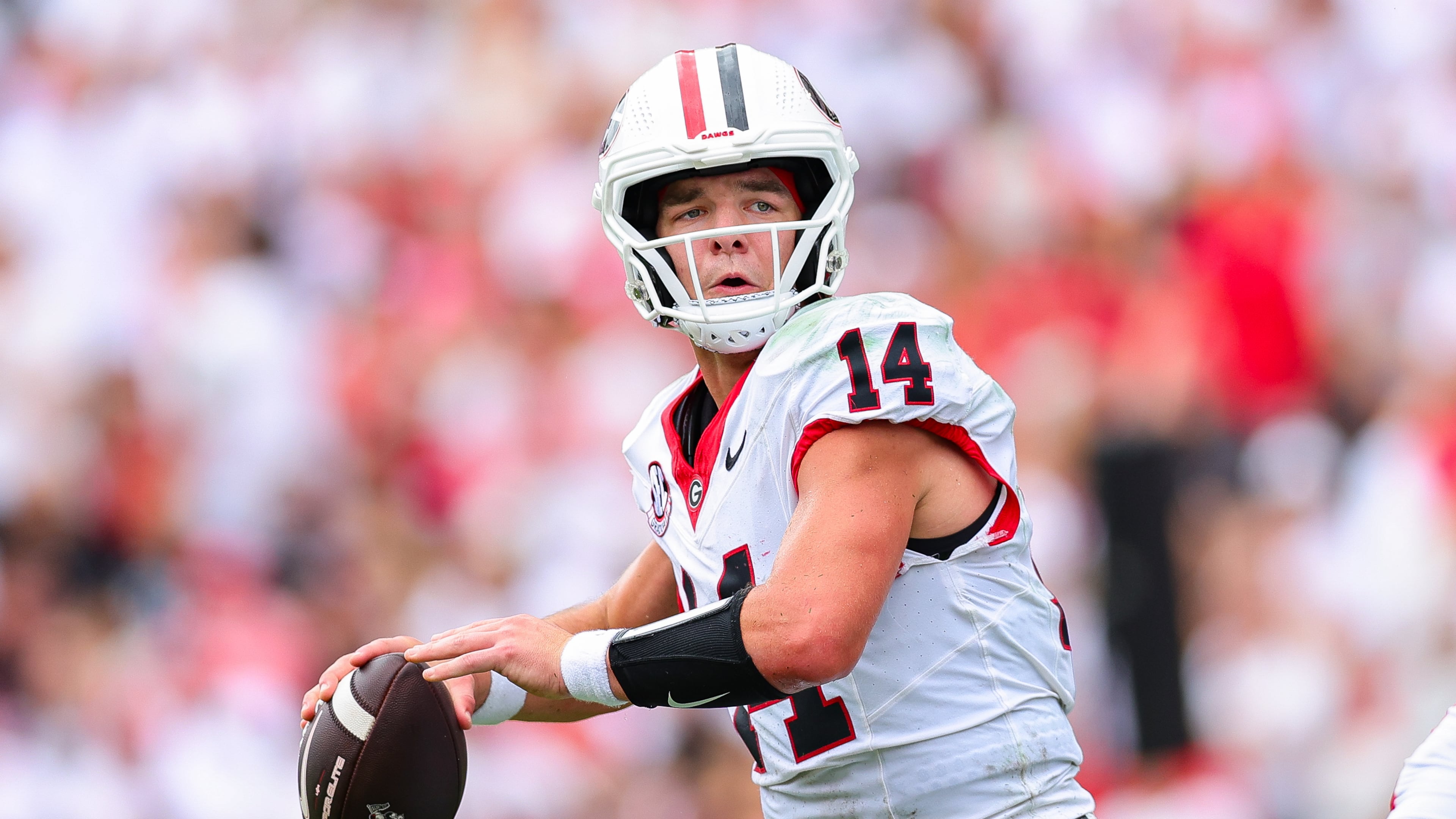 Georgia quarterback Gunner Stockton (14) looks to throw during the first half of an NCAA college football game against Western Kentucky, Saturday, Sept. 12, 2026, in Athens, Ga. (AP Photo/Colin Hubbard)