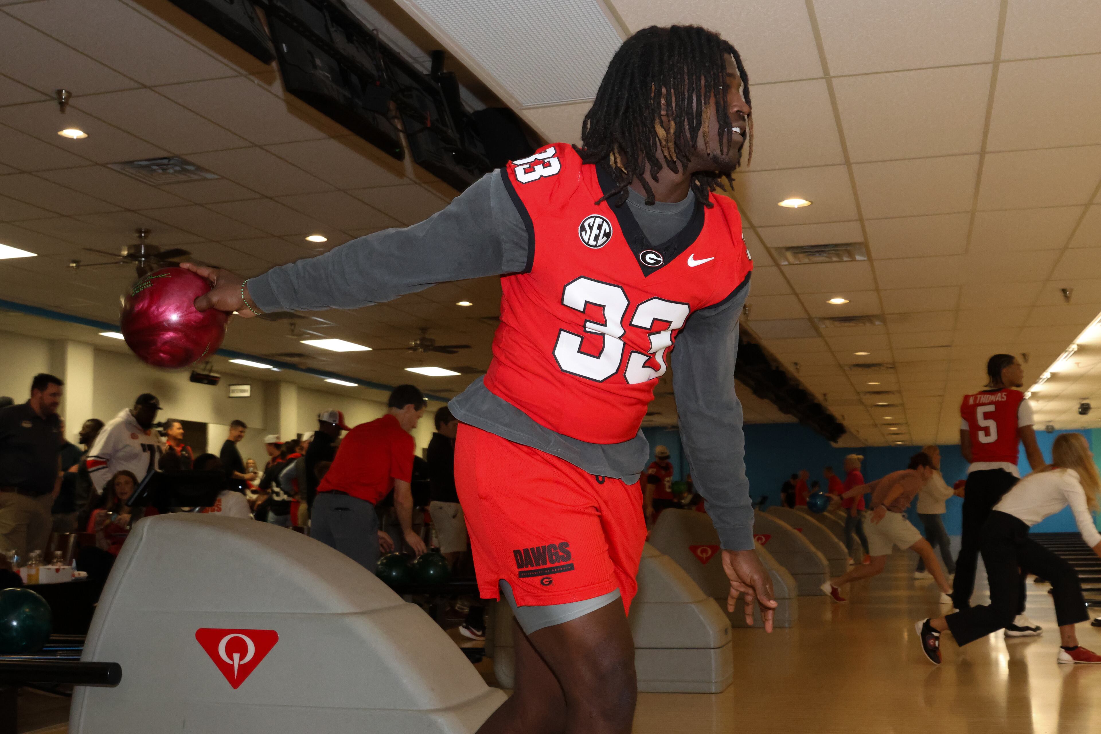 UGA outside linebacker Quintavius Johnson bowls during the third annual Chick-fil-A Dawg Bowl fundraiser for Parkinson’s and Crohn’s disease research at Showtime Bowl in Athens on Wednesday, Oct. 22, 2025. (C.J. Bartunek for the AJC)