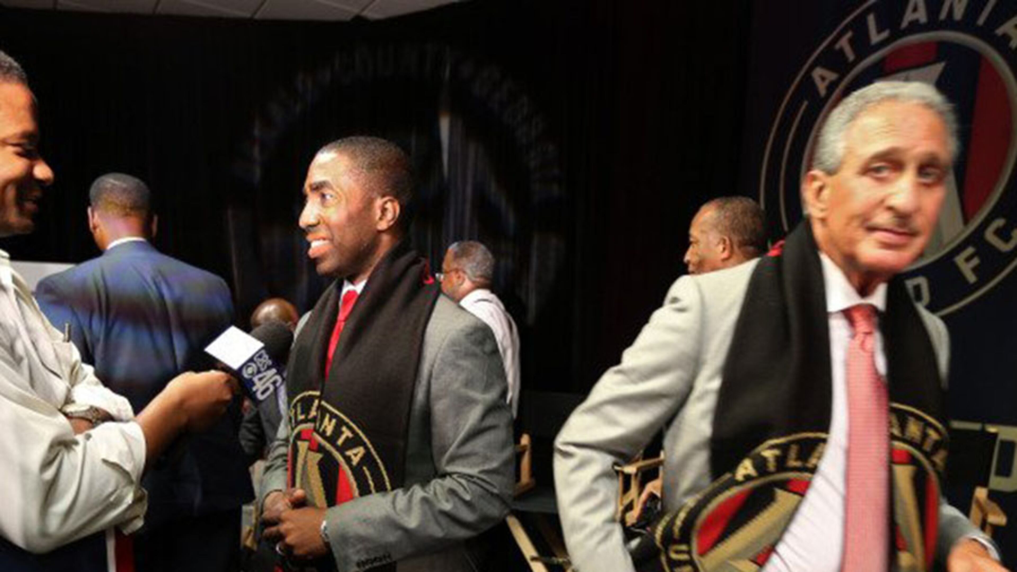Lee May, center, and Atlanta United soccer team owner Arthur Blank, right. The team will build its practice facility behind the DeKalb County jail because nothing says “New Downtown DeKalb” like a practice soccer field behind a jail.