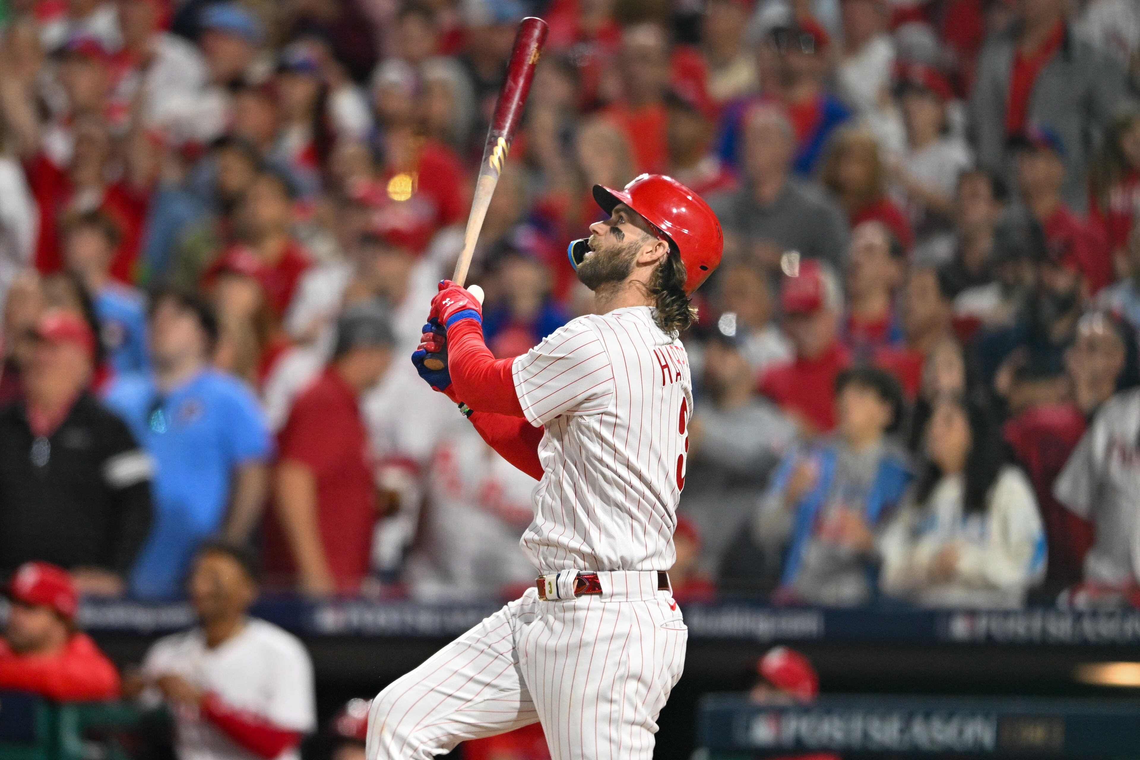 Philadelphia Phillies’ Bryce Harper hits a home run against the Atlanta Braves, his second homer of the evening, during the sixth inning of NLDS Game 3 in Philadelphia on Wednesday, Oct. 11, 2023. (Hyosub Shin / Hyosub.Shin@ajc.com)