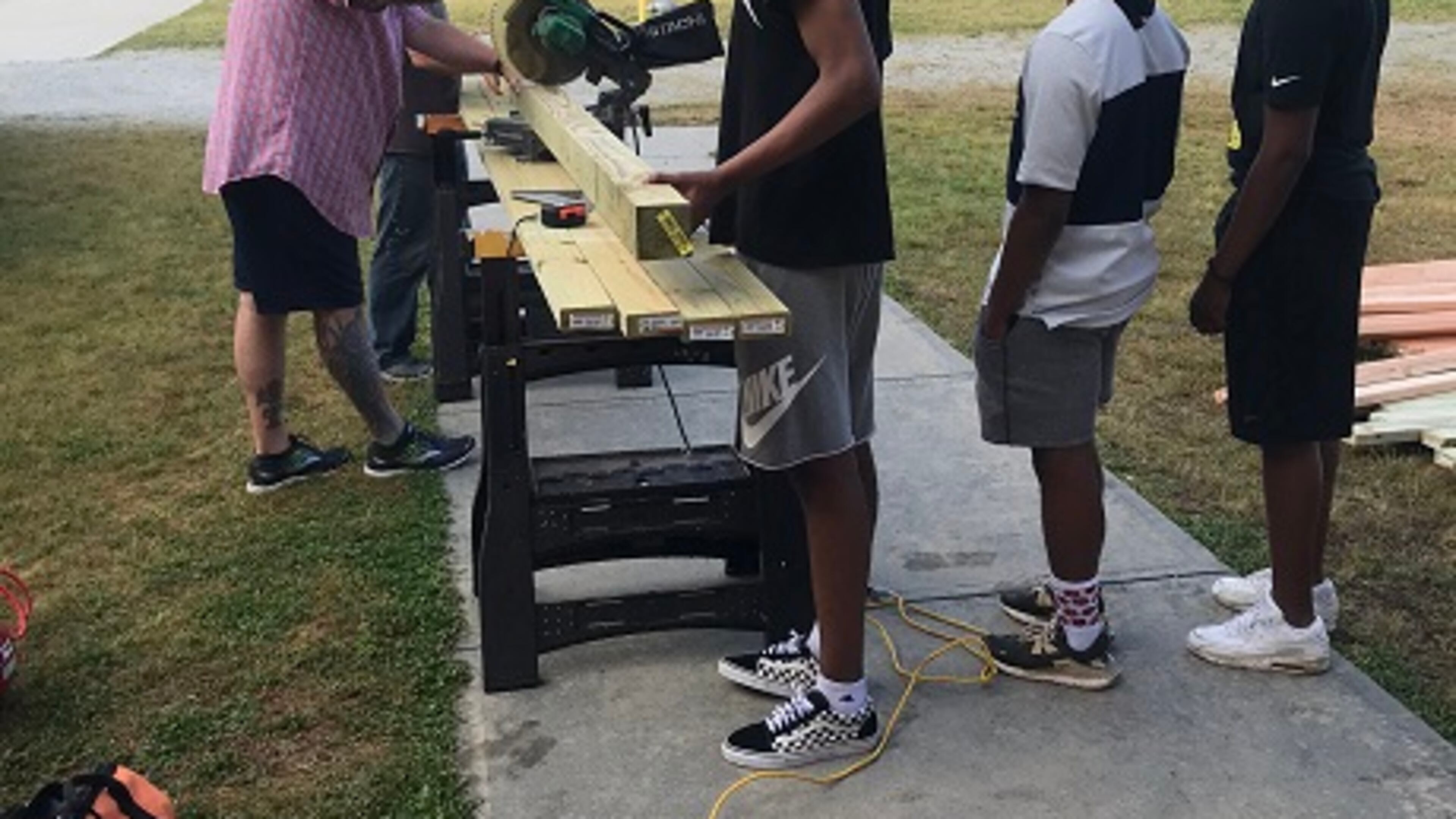 Archer High engineering students help build a chicken coop for Lovin Elementary. The joint project allows students at both schools to experience STEM curriculum. COURTESY OF GWINNETT COUNTY PUBLIC SCHOOLS