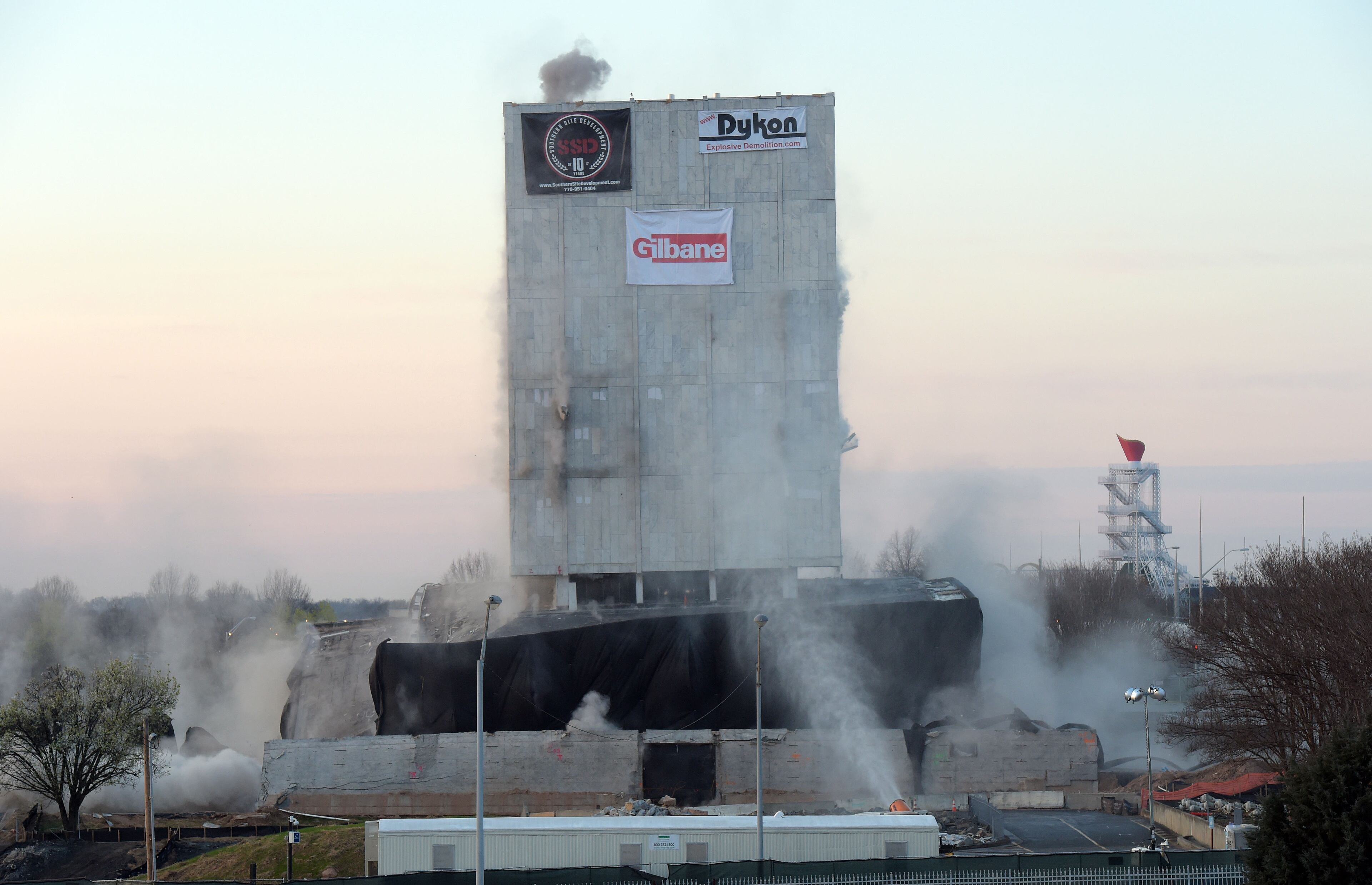 MARCH 5, 2017 7:05:07 AM ATLANTA Explosives go off in the structure as demolition crews bring down the old state archives building in a controlled implosion shortly after 7 am Sunday, March 5, 2017.. The 14 story state archives building was about 50 years old and was imploded to make way for a new state courts building. Gov. Deal has budgeted about $105 million in next year's budget for the new state courts building. Kent D. Johnson/AJC