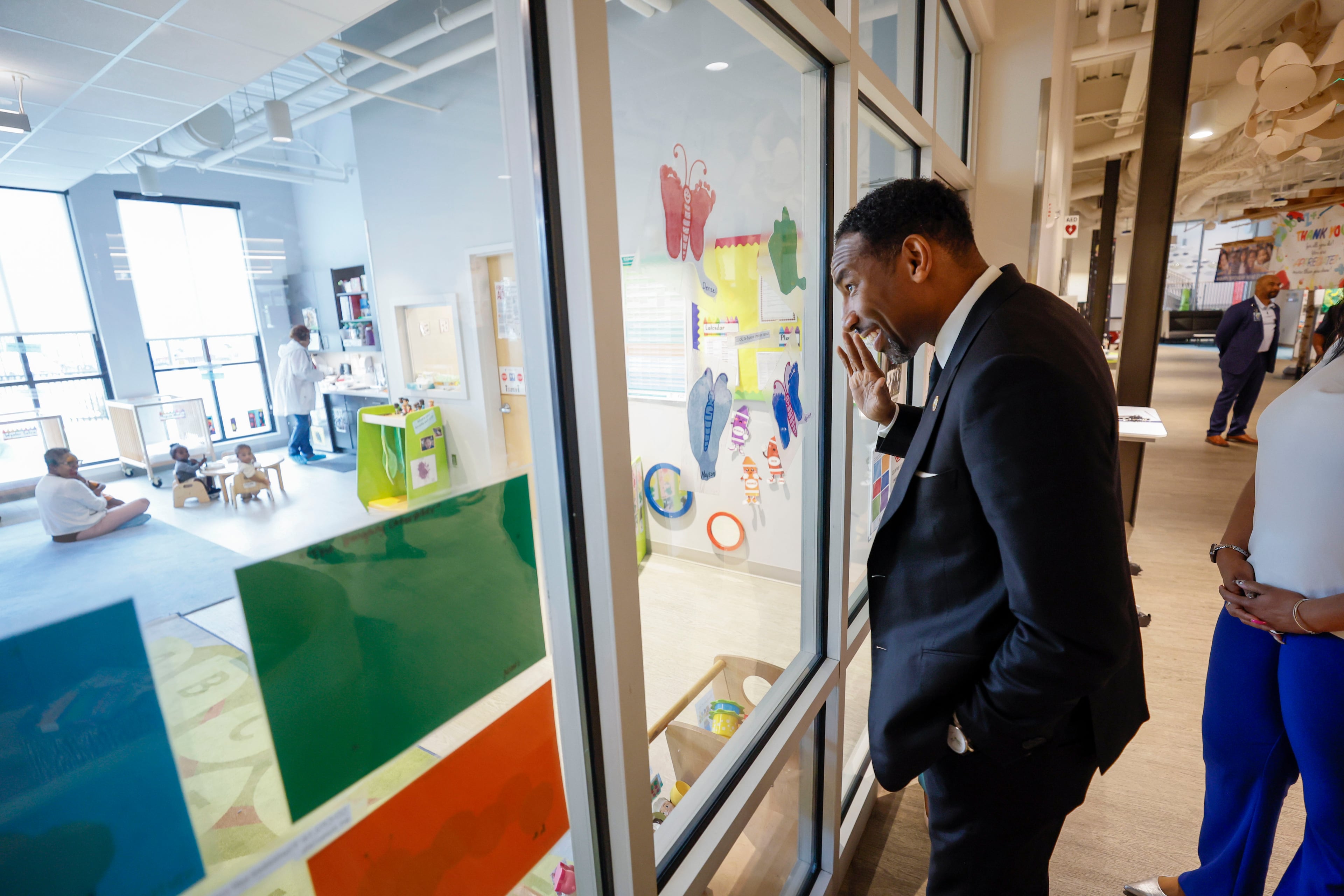 Atlanta Mayor Dicken waves to a classroom at the Arthur M. Blank Early Learning Center during a tour on Monday, as the federal Head Start program celebrates its 60th anniversary.
(Miguel Martinez/AJC)