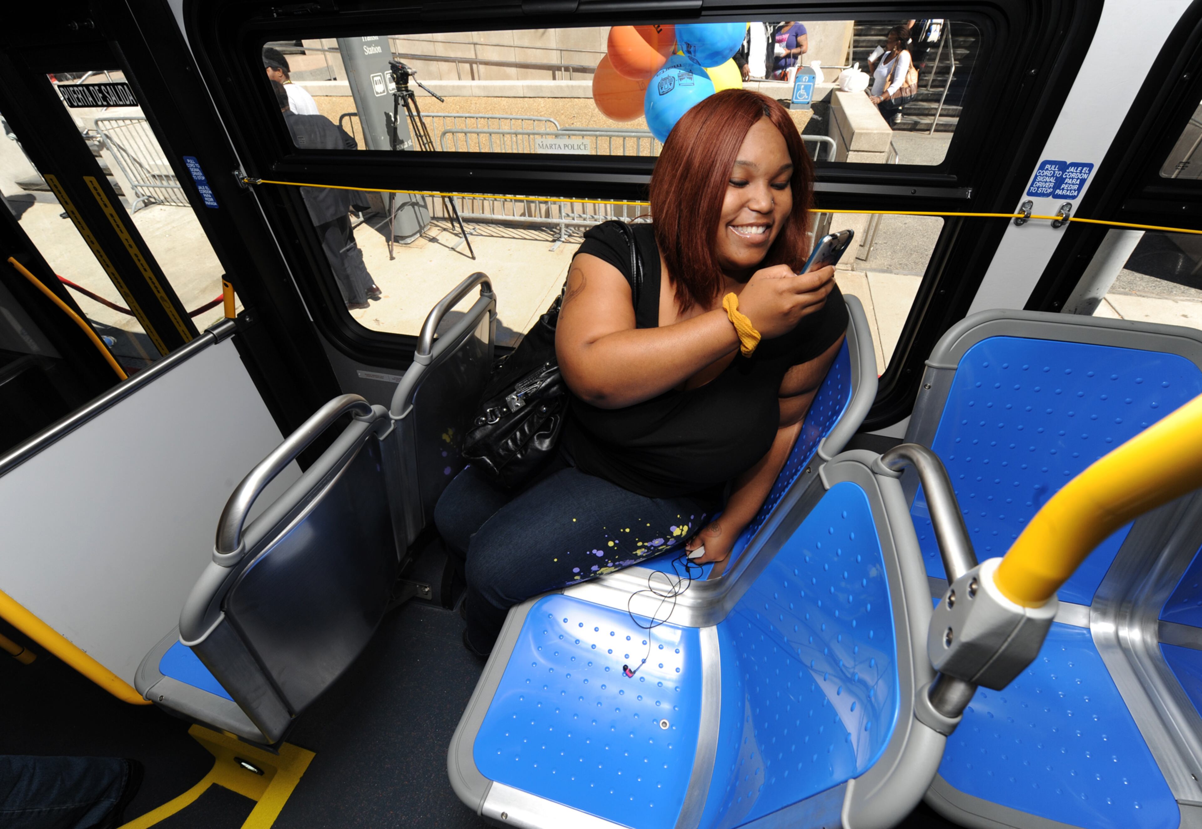Shaunta Washington takes photos of the ergonomic seating.