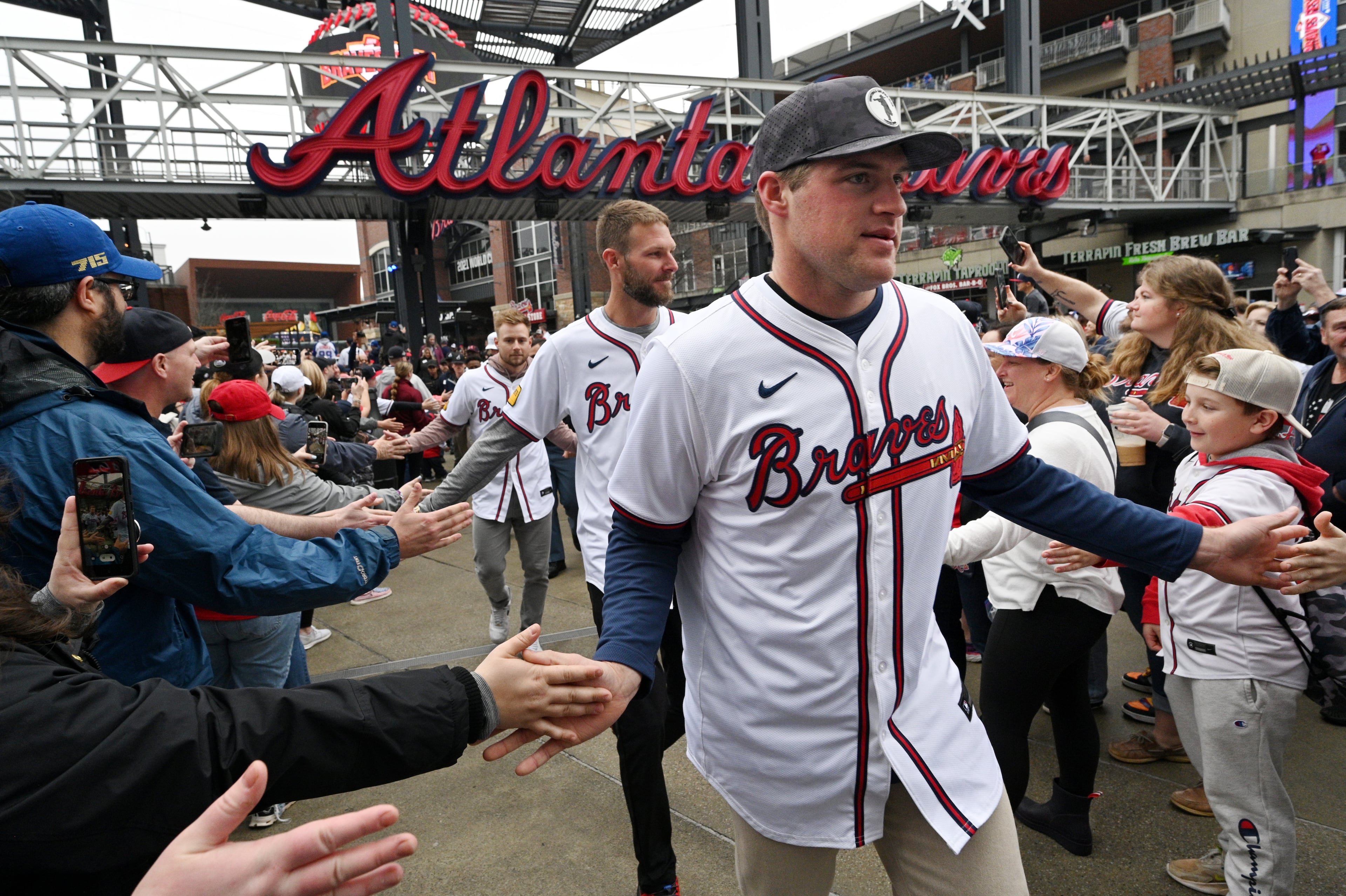 Atlanta Braves (foreground to background) pitcher Bryce Elder, pitcher Chris Sale and outfielder Jarred Kelenic participate in Braves Fest Opening Rally at The Battery Atlanta, Saturday, January 27, 2024, in Atlanta. (Hyosub Shin / Hyosub.Shin@ajc.com)