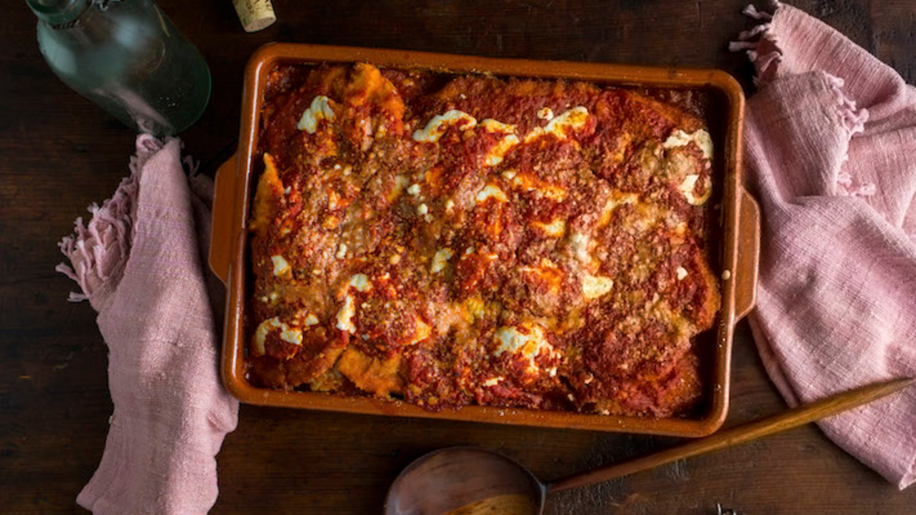 FILE -- A chicken Parmesan casserole in New York, January 2015. Leftover tomato sauce serves as a base for a luscious dinner of chicken or eggplant Parmesan. (Andrew Scrivani/The New York Times)