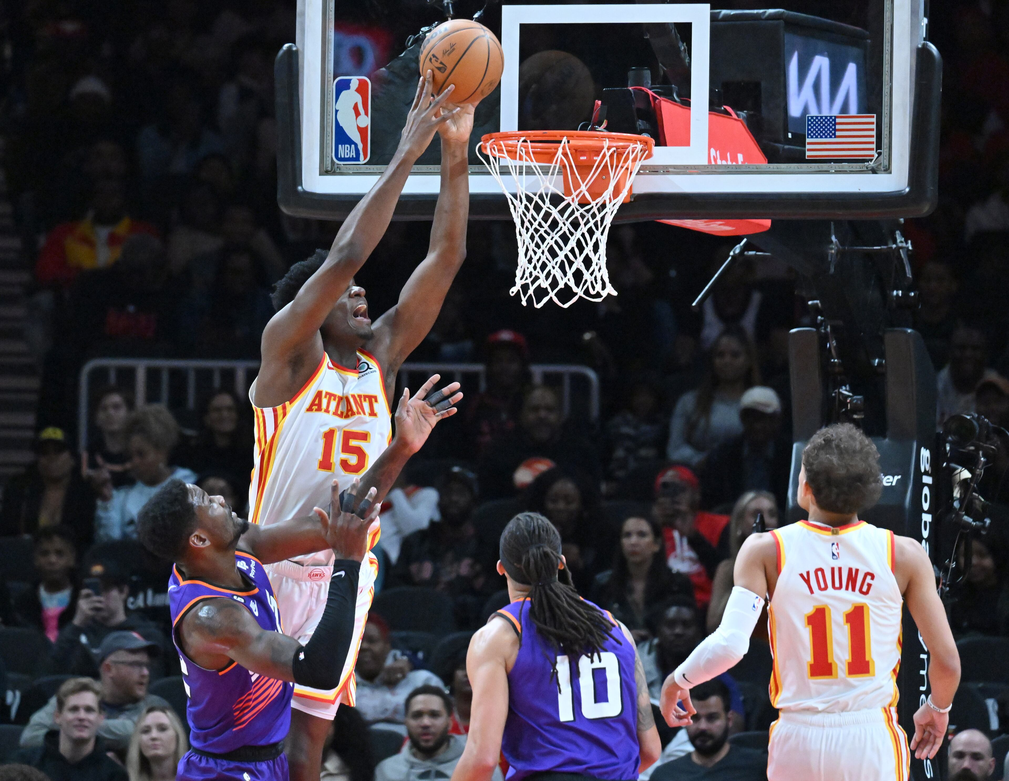 Atlanta Hawks' center Clint Capela (15) goes up for a shot over Phoenix Suns' center Deandre Ayton (22) during the second half in an NBA basketball game at State Farm Arena, Thursday, Feb. 9, 2023, in Atlanta. (Hyosub Shin / Hyosub.Shin@ajc.com)