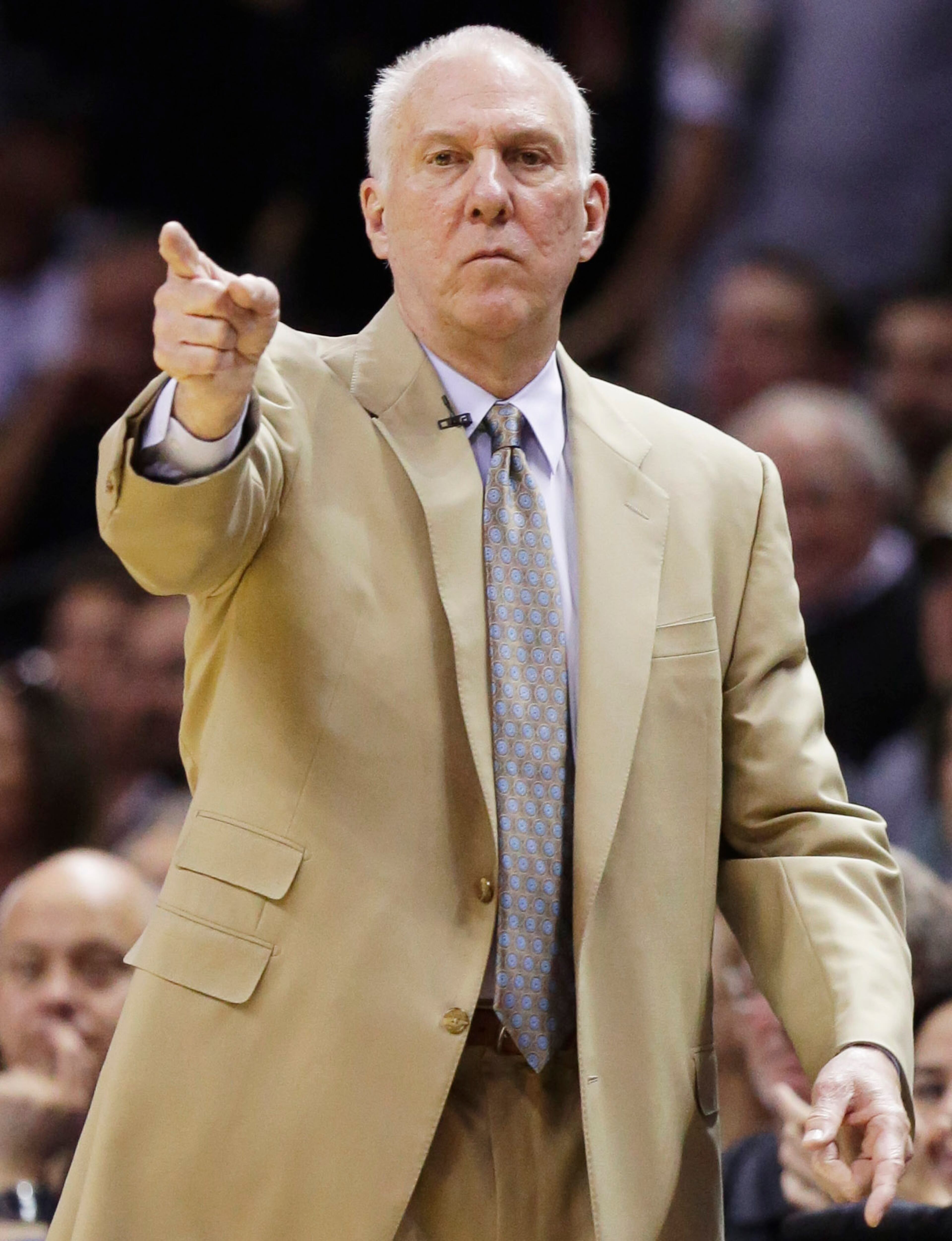 San Antonio Spurs head coach Gregg Popovich works the sideline against the Miami Heat during the first half in Game 2 of the NBA basketball finals on Sunday, June 8, 2014, in San Antonio. (AP Photo/Eric Gay)