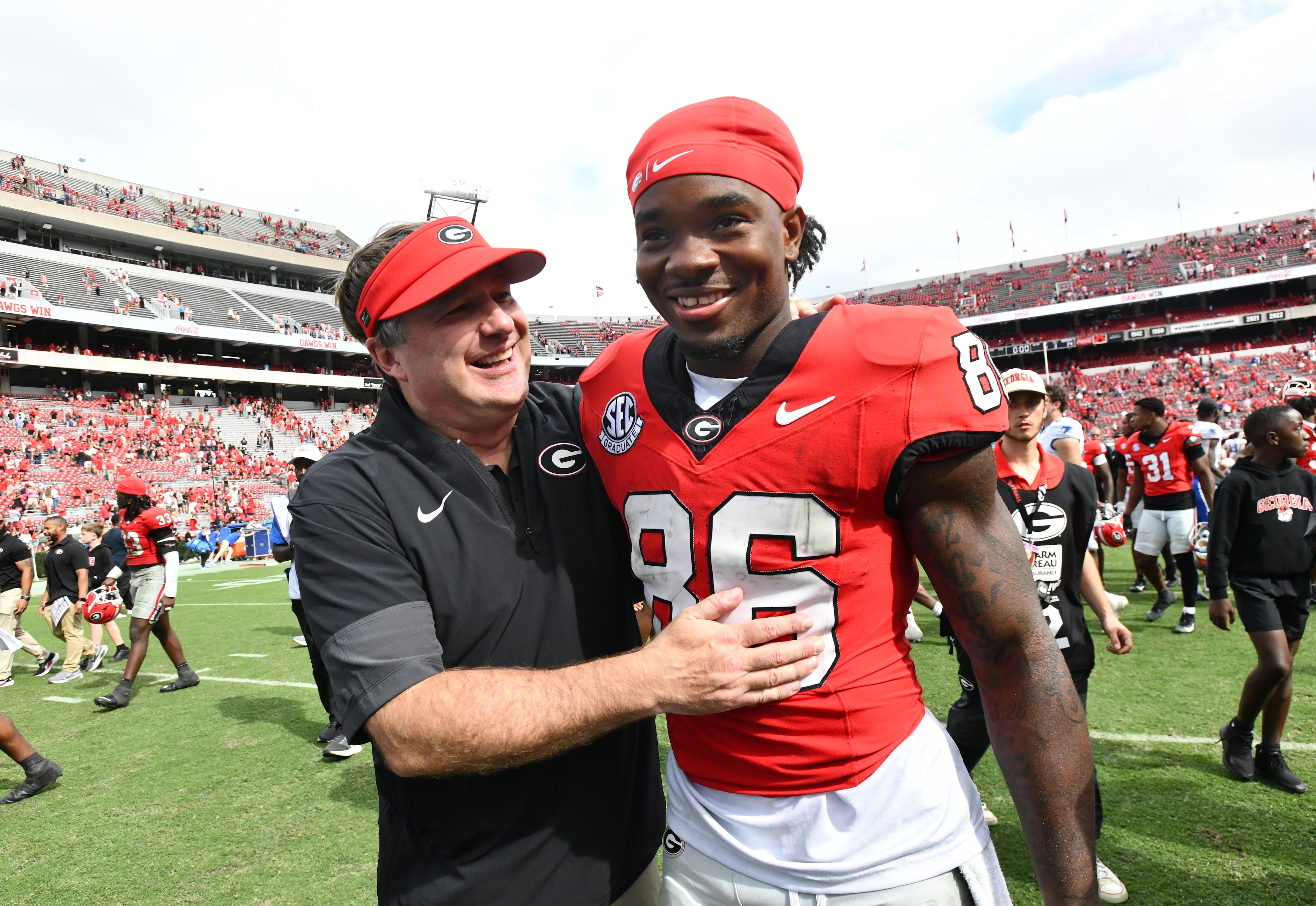 Georgia head coach Kirby Smart celebrates with Georgia wide receiver Dillon Bell (86) after Georgia beat Kentucky during a NCAA college football game at Sanford Stadium, Saturday, October 4, 2025, in Athens. Georgia won 35 -14 over Kentucky. (Hyosub Shin / AJC)