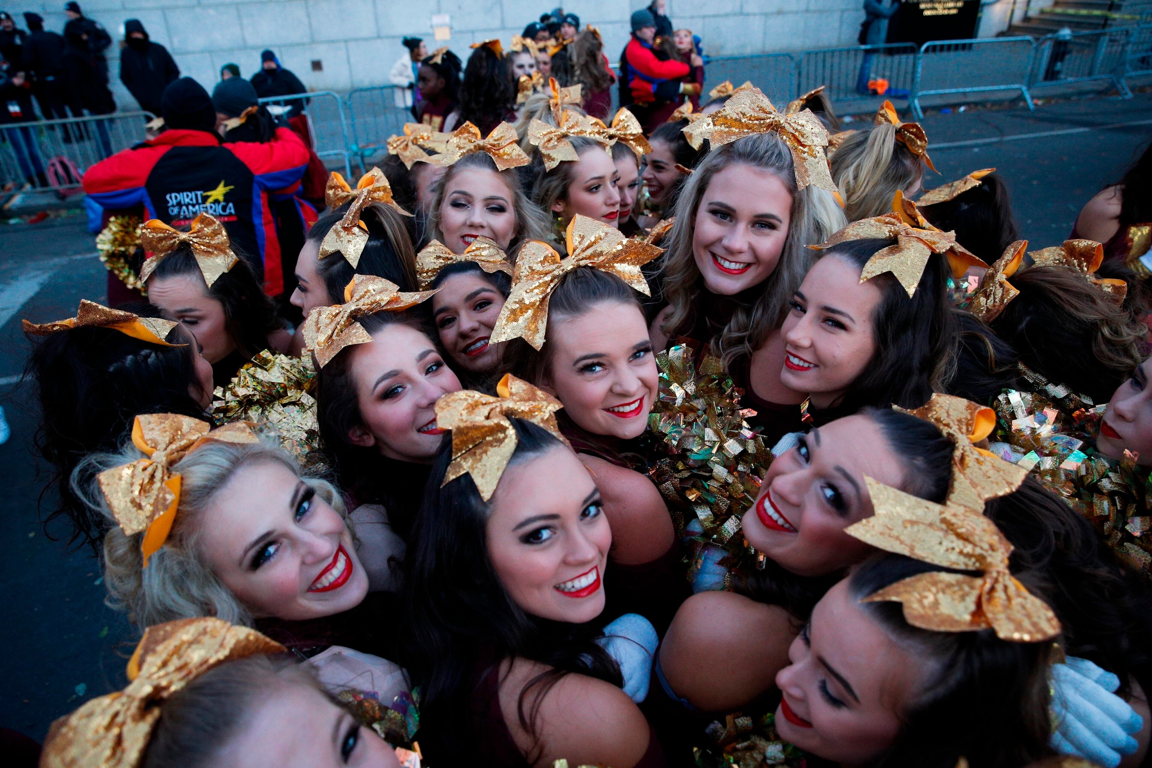 Performers stay warm before the 92nd annual Macy's Thanksgiving Day Parade in New York, Thursday, Nov. 22, 2018. (AP Photo/Eduardo Munoz Alvarez)