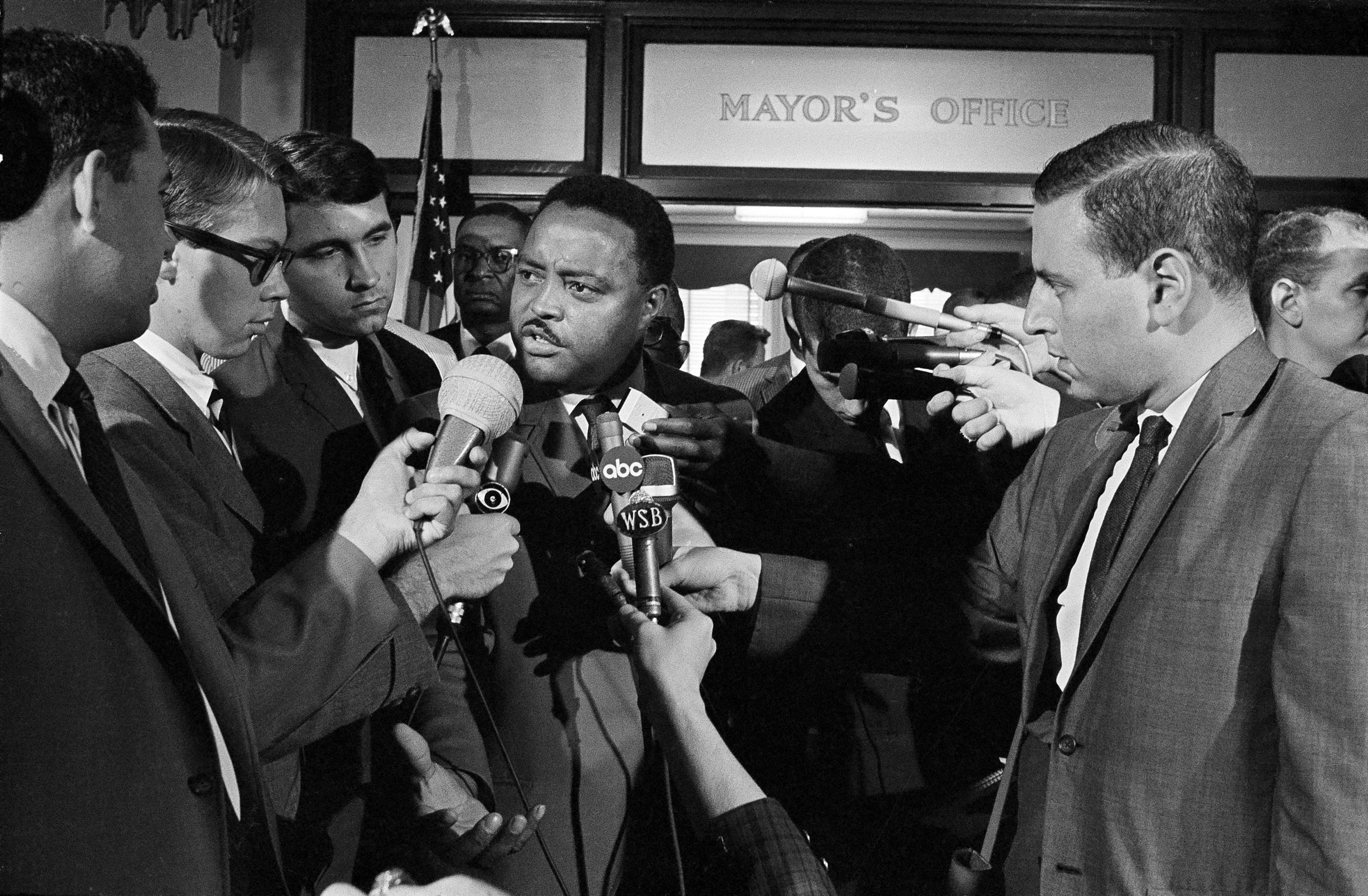 Hosea Williams, an aide to civil rights leader Martin Luther King Jr., speaks to newsmen, Sept. 12, 1966, after he and other civil rights leaders met with Atlanta Mayor Ivan Allen Jr. The conference was called to discuss means to end outbreaks of violence in Atlanta.
