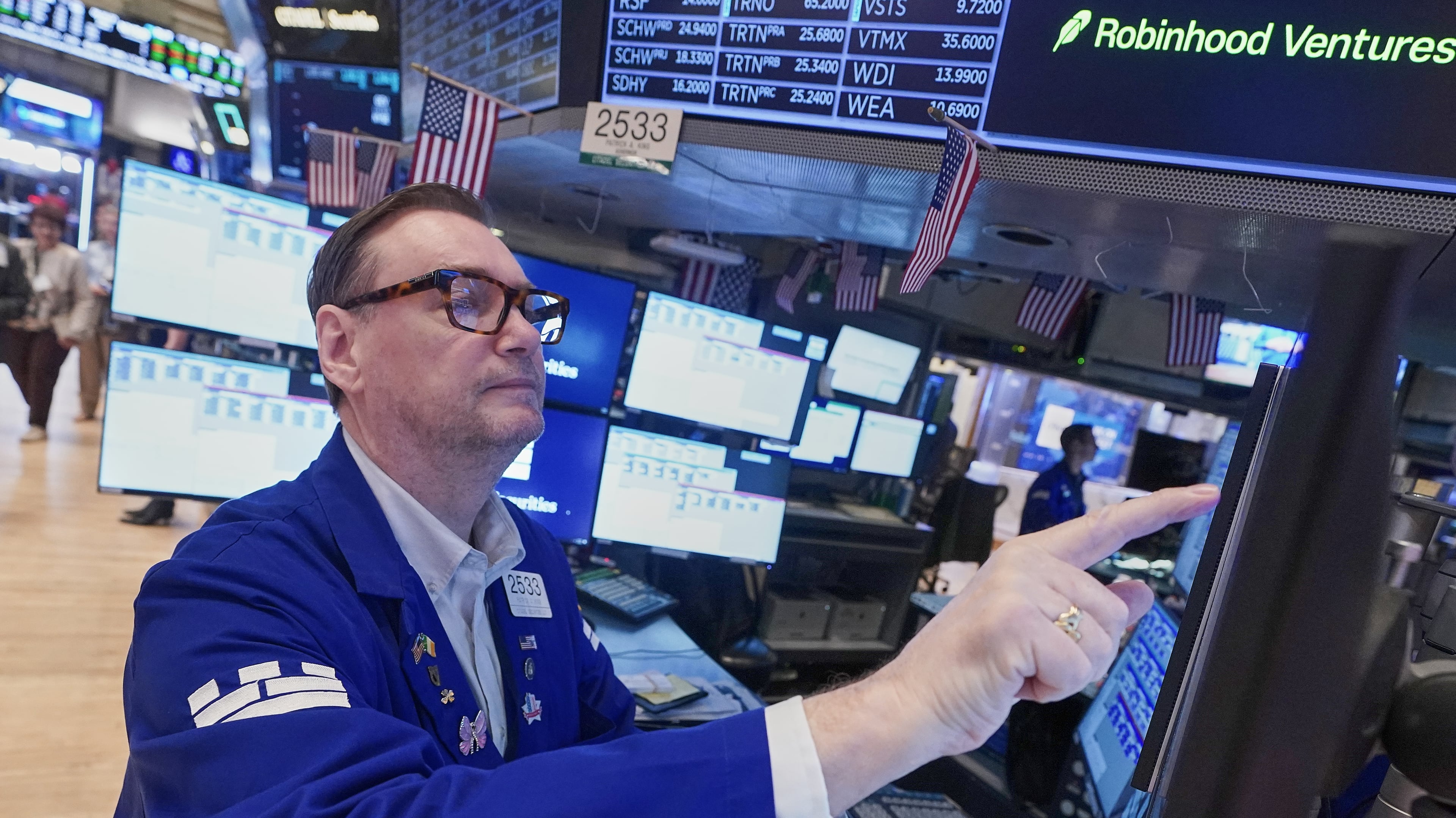 Specialist Patrick King works at his post on the floor of the New York Stock Exchange, Friday, May 1, 2026. (AP Photo/Richard Drew)