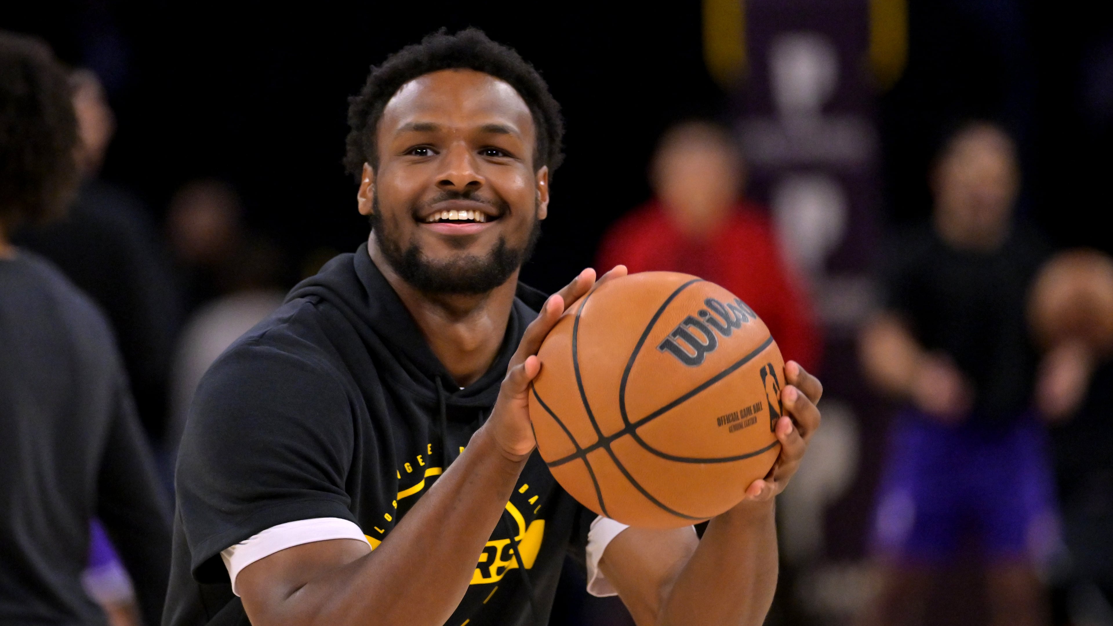 Los Angeles Lakers guard Bronny James warms up prior to an NBA basketball game against the Utah Jazz, Sunday, April 12, 2026, in Los Angeles. (AP Photo/Jayne Kamin-Oncea)