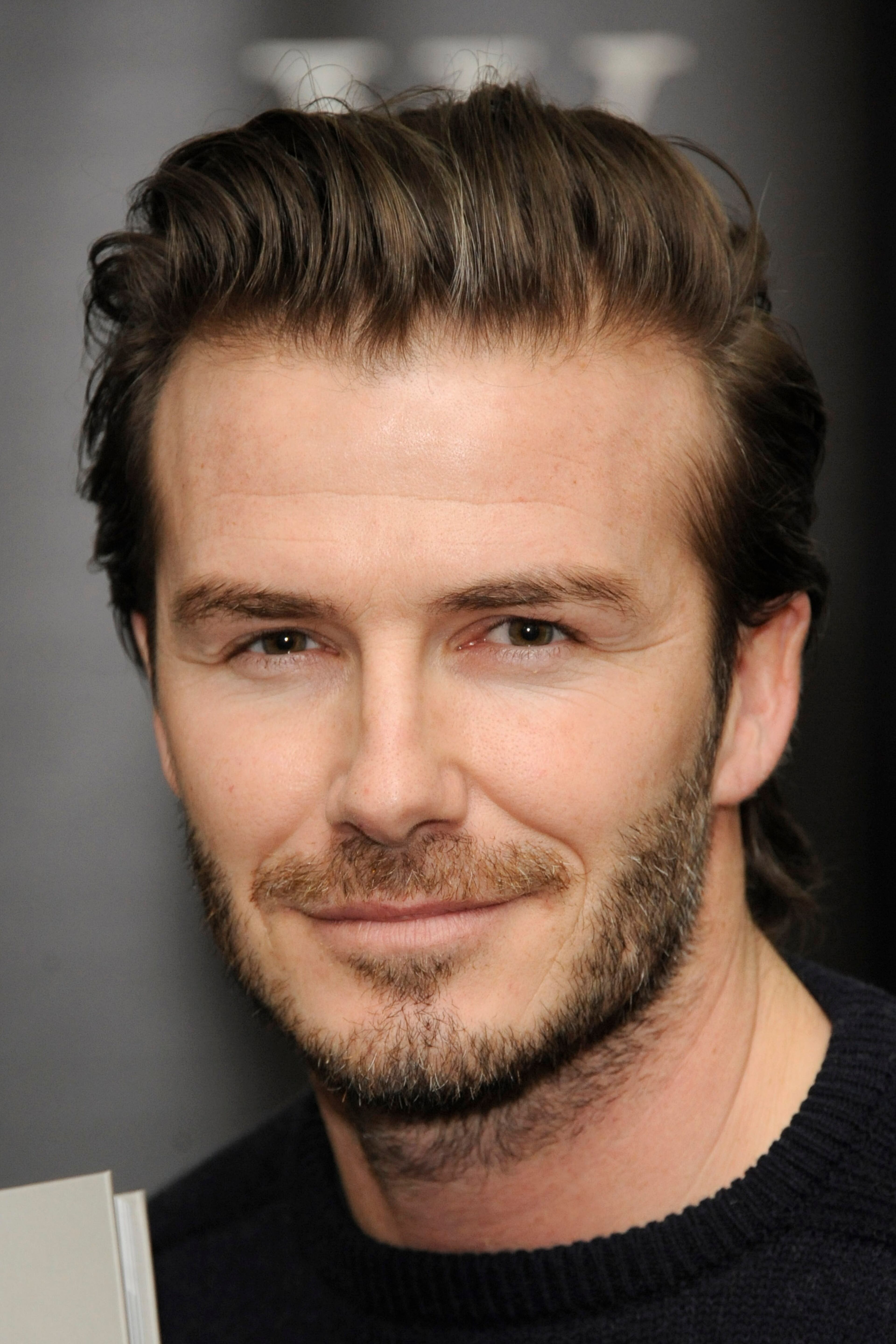 LONDON, UNITED KINGDOM - DECEMBER 19: David Beckham meets fans and signs copies of his new self titled book at Waterstone's, Piccadilly on December 19, 2013 in London, England. (Photo by Stuart C. Wilson/Getty Images)