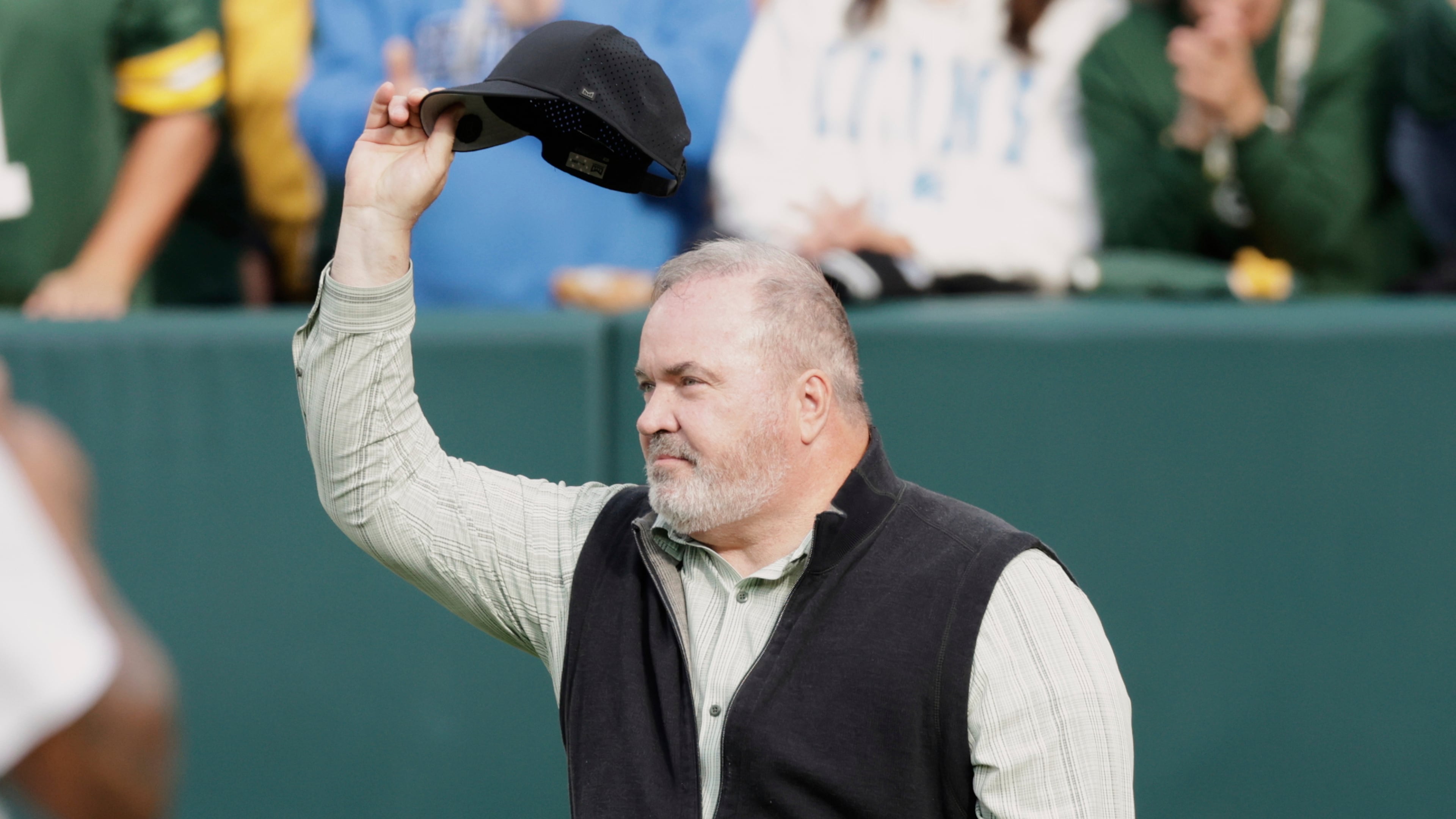 FILE - Former Green Bay Packers head coach Mike McCarthy waves during halftime of an NFL football game against the Detroit Lions Sunday, Sept. 7, 2025, in Green Bay, Wis. (AP Photo/Matt Ludtke, File)