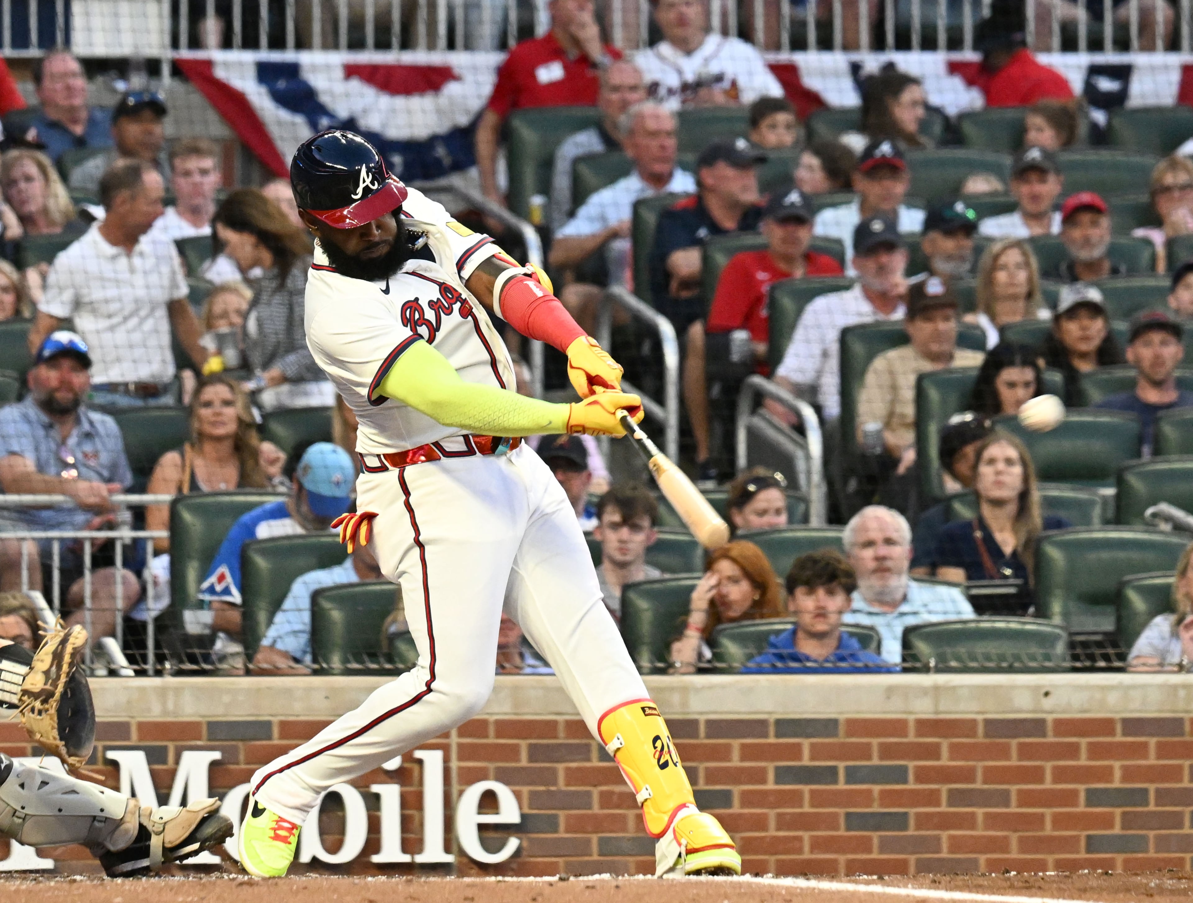 Atlanta Braves designated hitter Marcell Ozuna (20) hits a 2 RBI double to score Atlanta Braves second base Ozzie Albies and Atlanta Braves outfielder Michael Harris II during the third inning of home opener baseball game at Truist Park, Friday, April 4, 2025, in Atlanta. (Hyosub Shin / AJC)