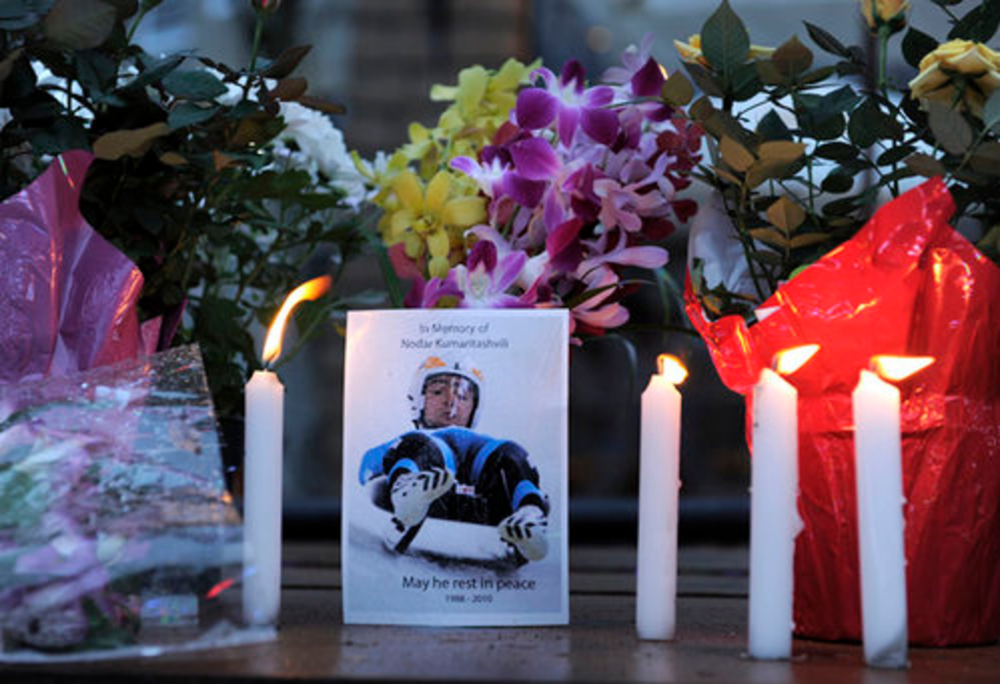 The opening ceremonies had a somber tone, after Georgian luge athlete Nodar Kumaritashvili was killed earlier in the day Friday on a training run. A memorial was placed under the Olympic rings in Whistler, British Columbia.