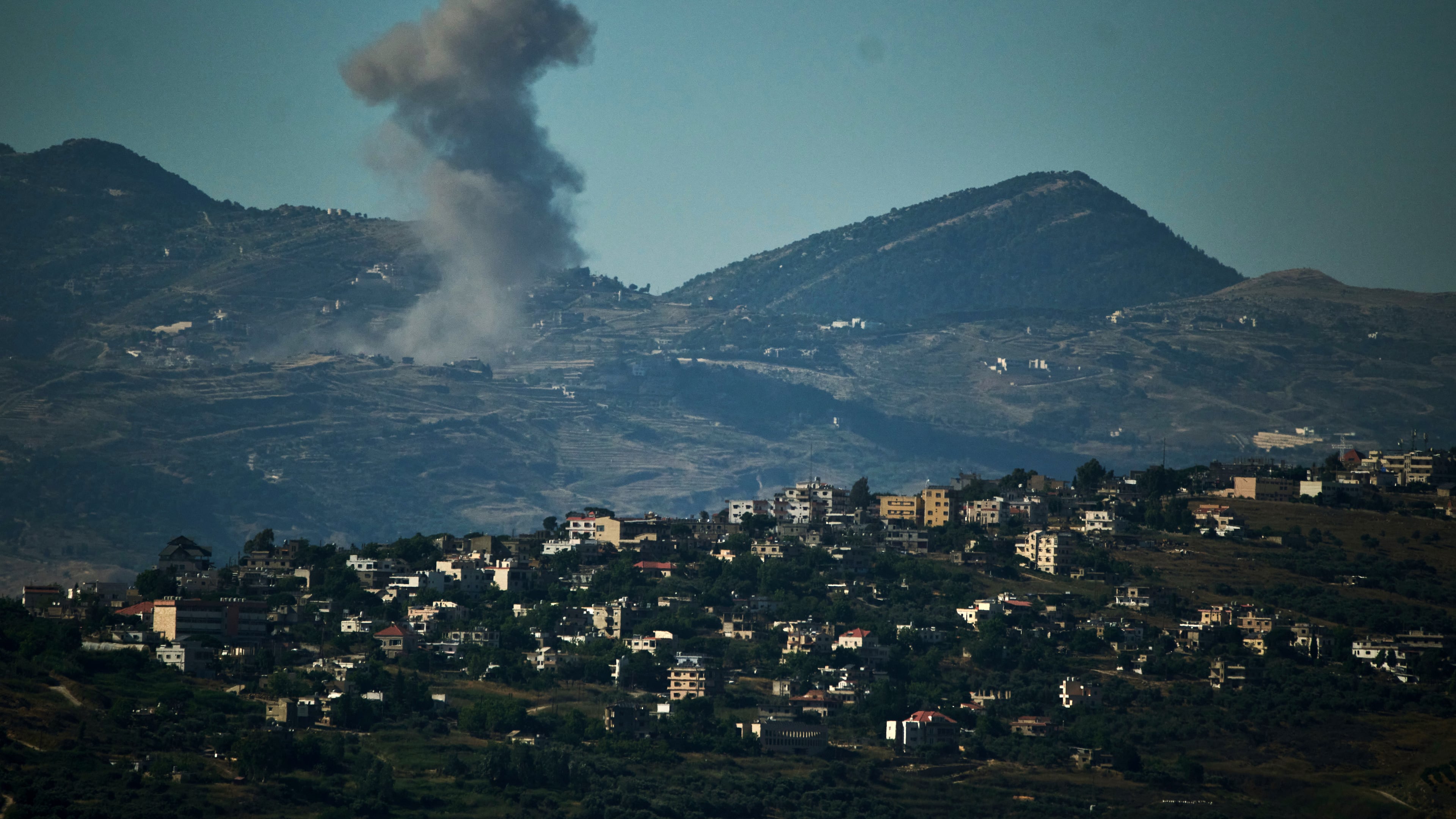 Smoke rises to the sky following an Israeli military strike in southern Lebanon as seen from northern Israel, Friday, June 19, 2026. (AP Photo/Leo Correa)