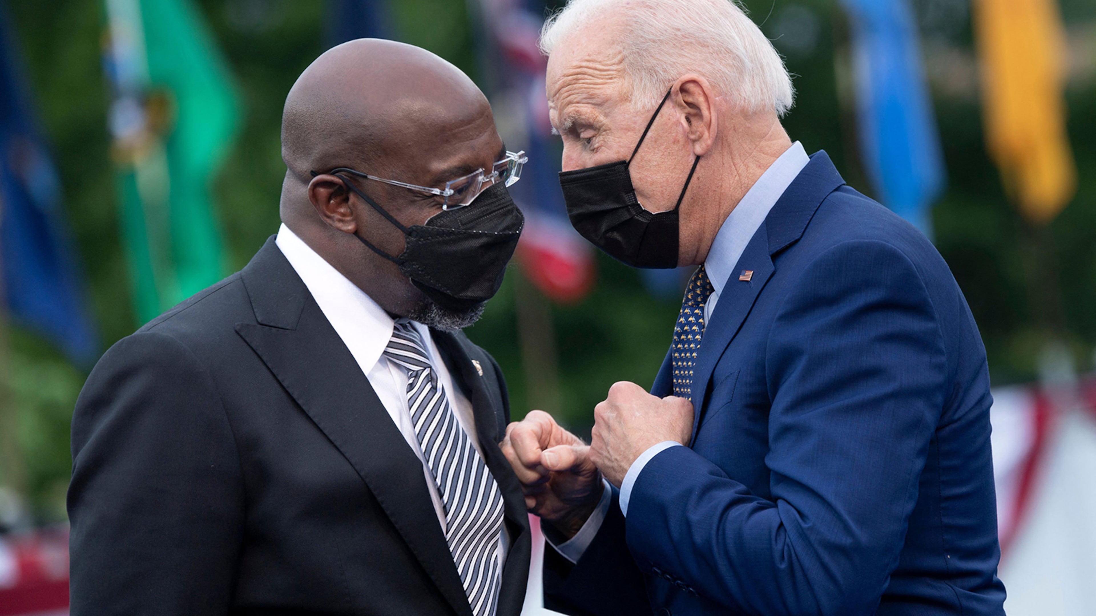 President Joe Biden, right, said he hopes to have a decision by the end of the week on whether to suspend the federal gas tax of 18 cents a gallon. U.S. Sen. Raphael Warnock has been among the biggest supporters seeking a federal gas tax holiday as a way to ease inflation. (Brendan Smialowski/AFP via Getty Images/TNS)