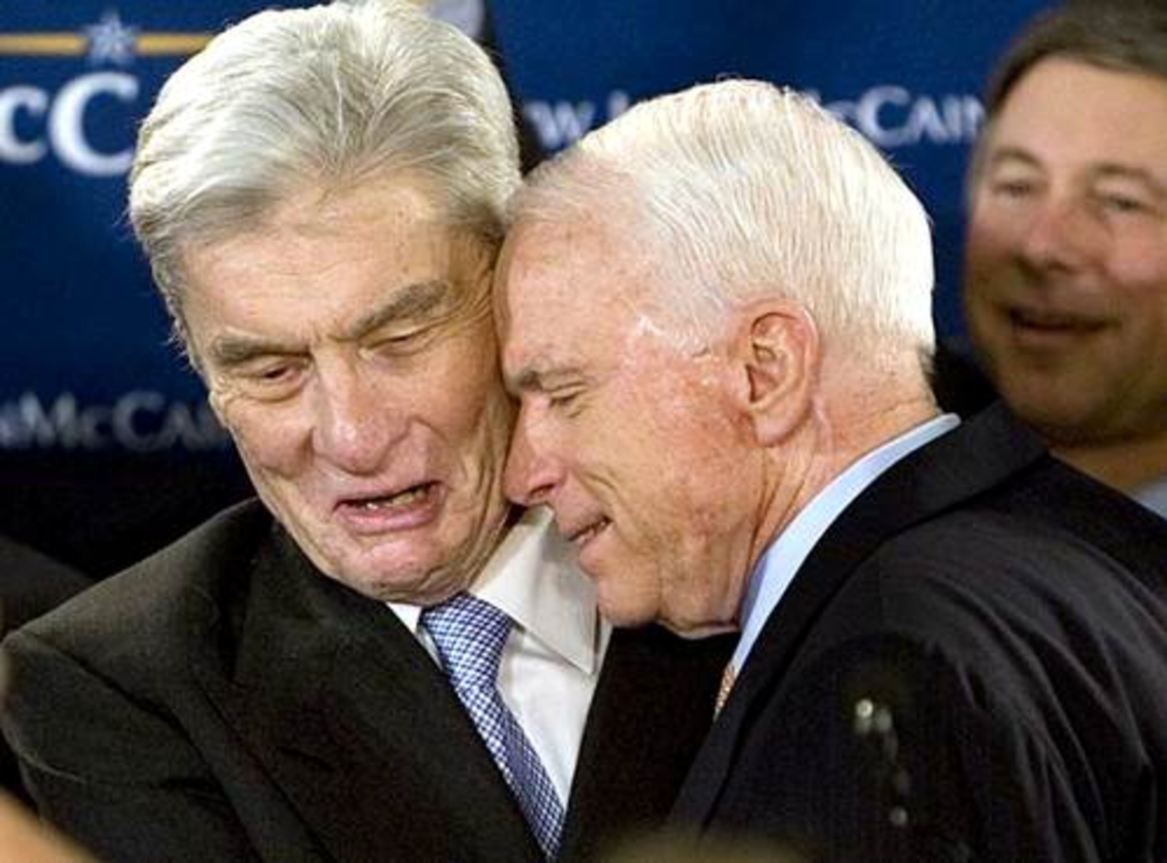 John McCain is embraced by Sen. John Warner (R-Va.) as he greets supporters Tuesday night in Alexandria, Va.