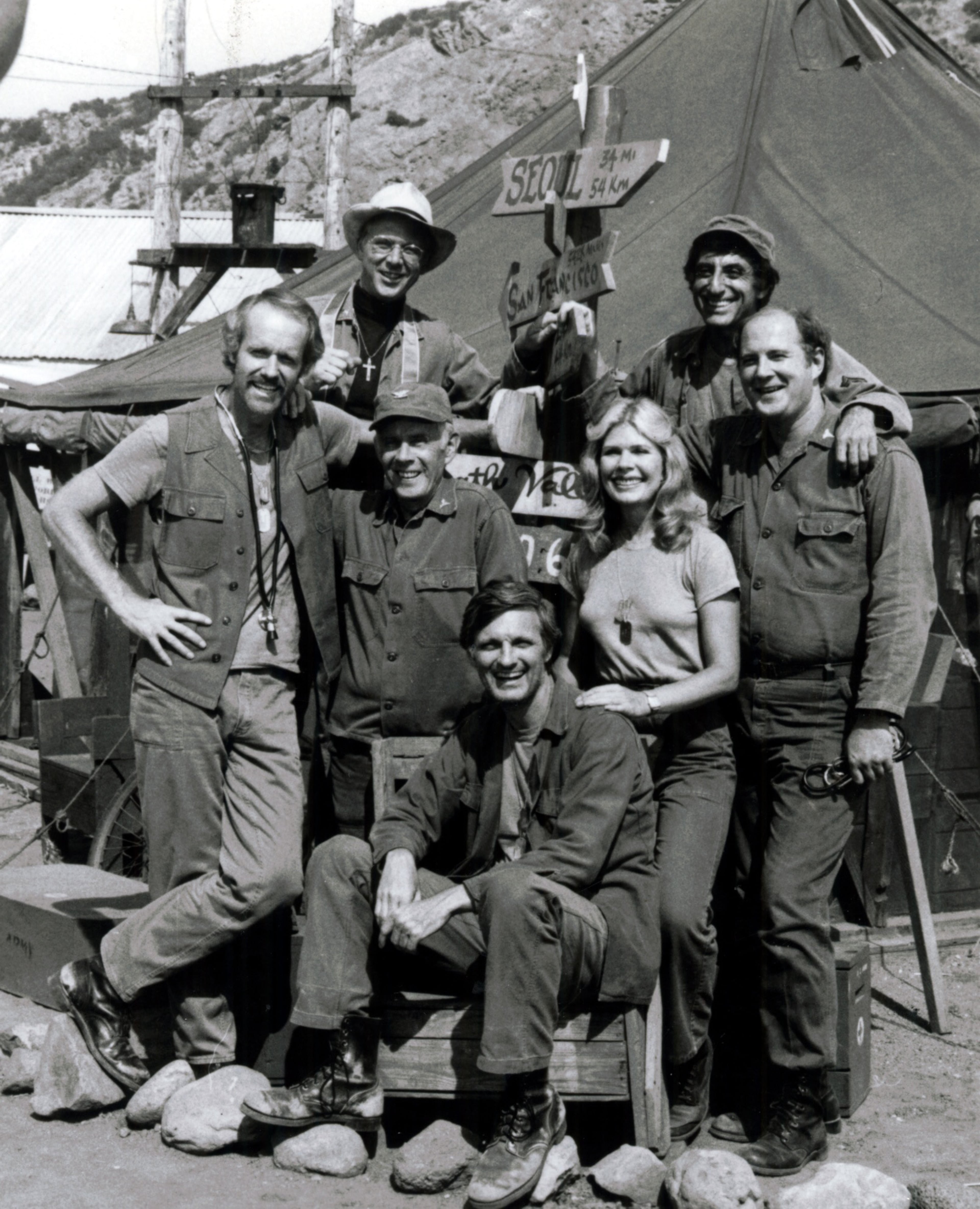 "M*A*S*H" picked up where the movie of the same name left off, following a team of doctors during the Korean War, including characters played by Alan Alda (seated center), and beginning at Alda's left, clockwise) Harry Morgan, Mike Farrell, William Christopher, Jamie Farr, David Ogden Stiers, and Loretta Swit. The show ran from 1972-1983, with the series finale being the most watched television episode ever at the time.