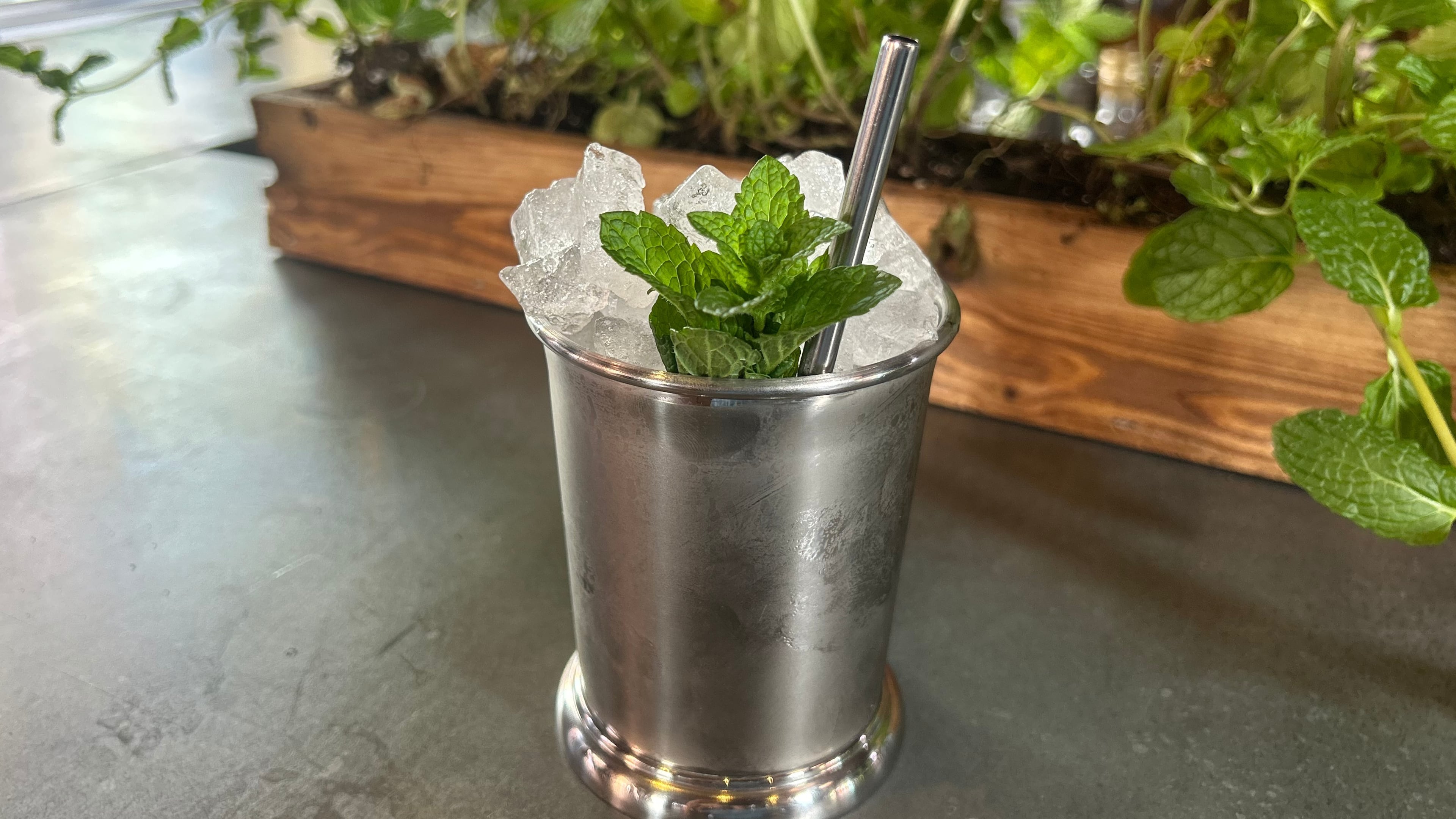 A Mint Julep cocktail is displayed at the cocktail bar Cato in London on April 22, 2026. (AP Photo/Louise Dixon)