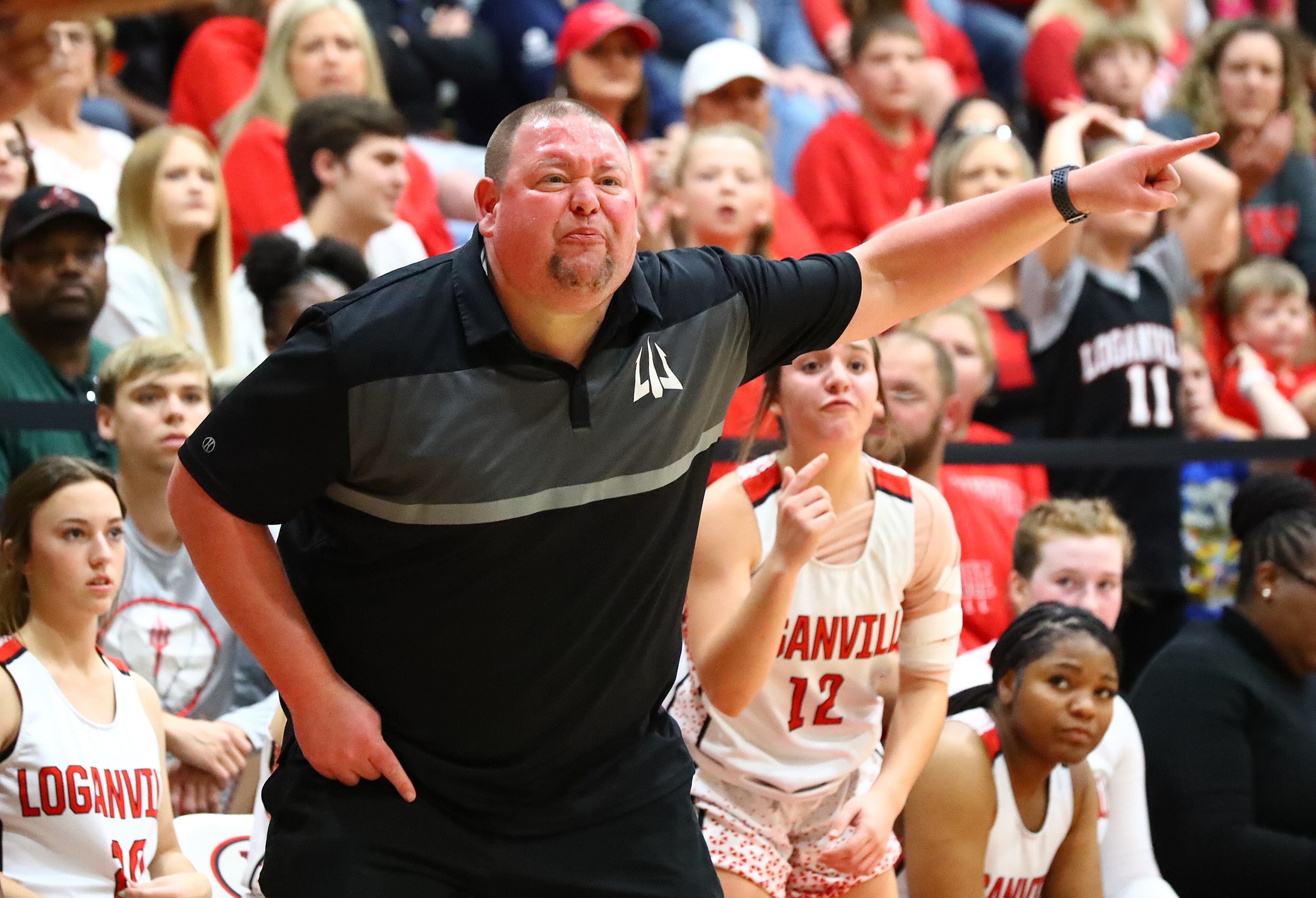 Loganville head coach John Zorn coaches his team on offense against Forest Park in their high school basketball tournament game on Wednesday, March 2, 2022, in Loganville. “Curtis Compton / Curtis.Compton@ajc.com”`