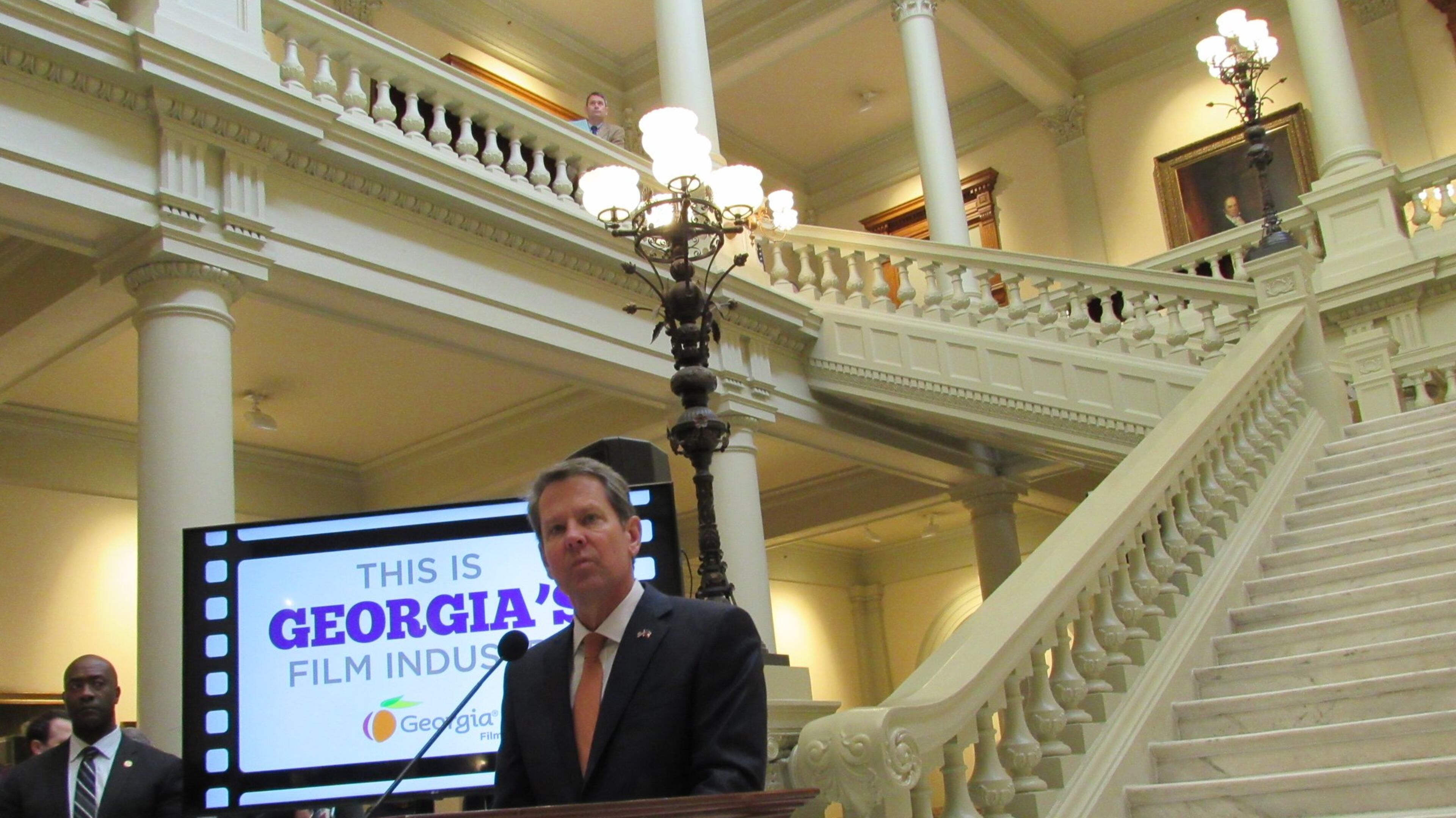While speaking Tuesday at Georgia Film Day, Gov. Brian Kemp thanked the industry for making Georgia “the top state for on-location filming.” He added: “Our film and television projects showcase to the rest of the world the true extent of our state’s beauty and diversity. Like you, I’m proud to see the peach logo at the end of a new movie or TV show.” Photo: Jennifer Brett, jbrett@ajc.com