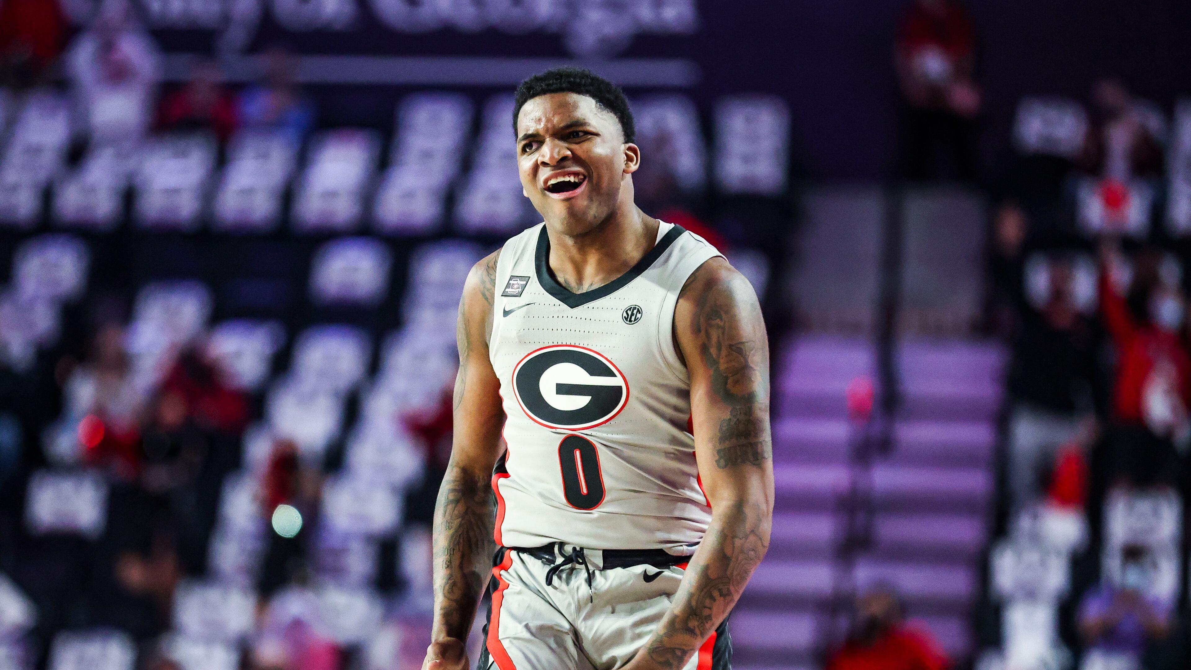 Georgia basketball player K.D. Johnson reacts after making a basket against Alabama at Stegeman Coliseum in Athens on Saturday, March 6, 2021. (Photo by Tony Walsh/UGA Athletics)
