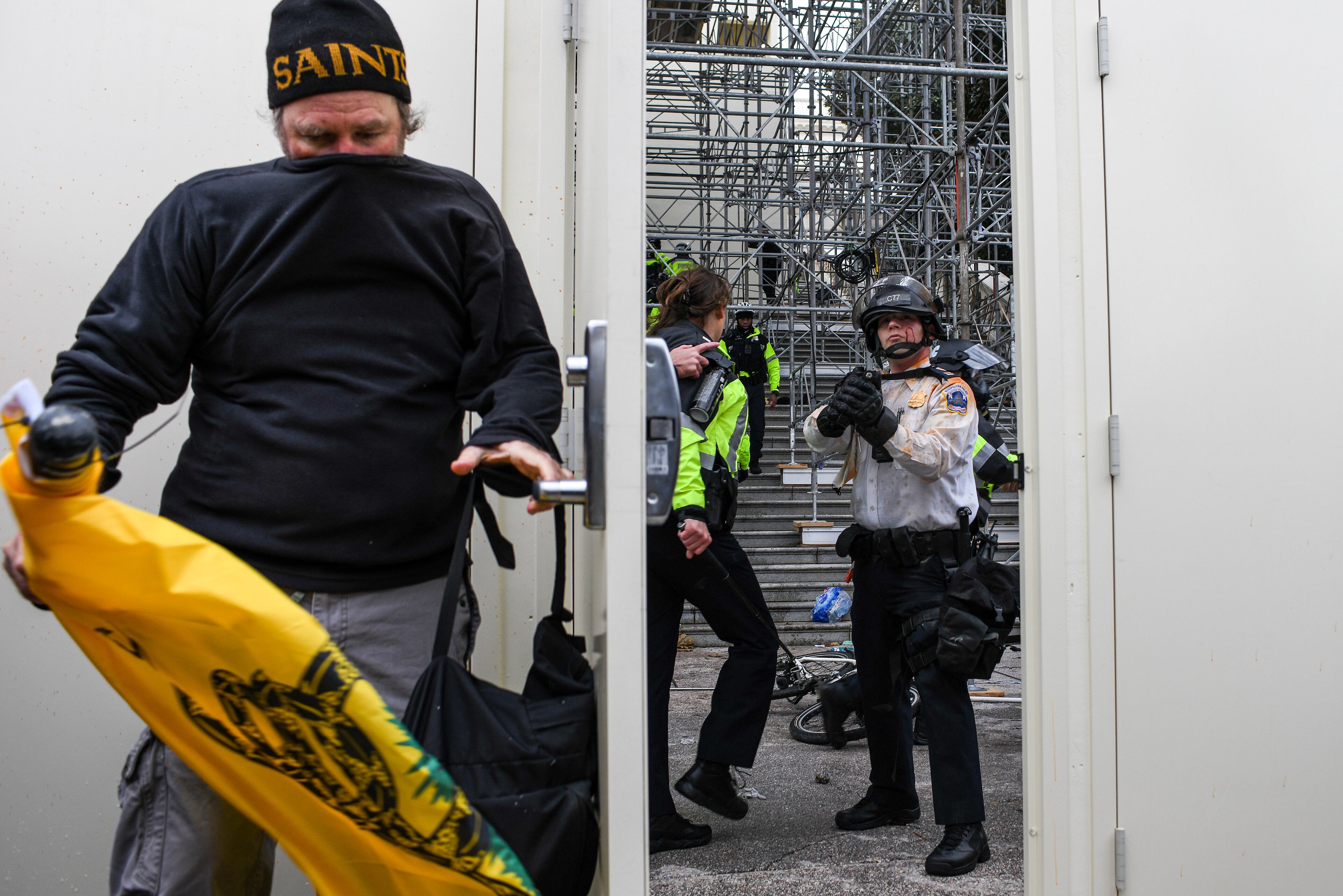 FILE - Members of a pro-Trump mob invade the U.S. Capitol in Washington, Jan. 6, 2021. New testimony underscores how a critical miscommunication between top military officials contributed to a four-hour delay in deploying troops to help restore order at the Capitol on Jan. 6, 2021. (Kenny Holston/The New York Times)