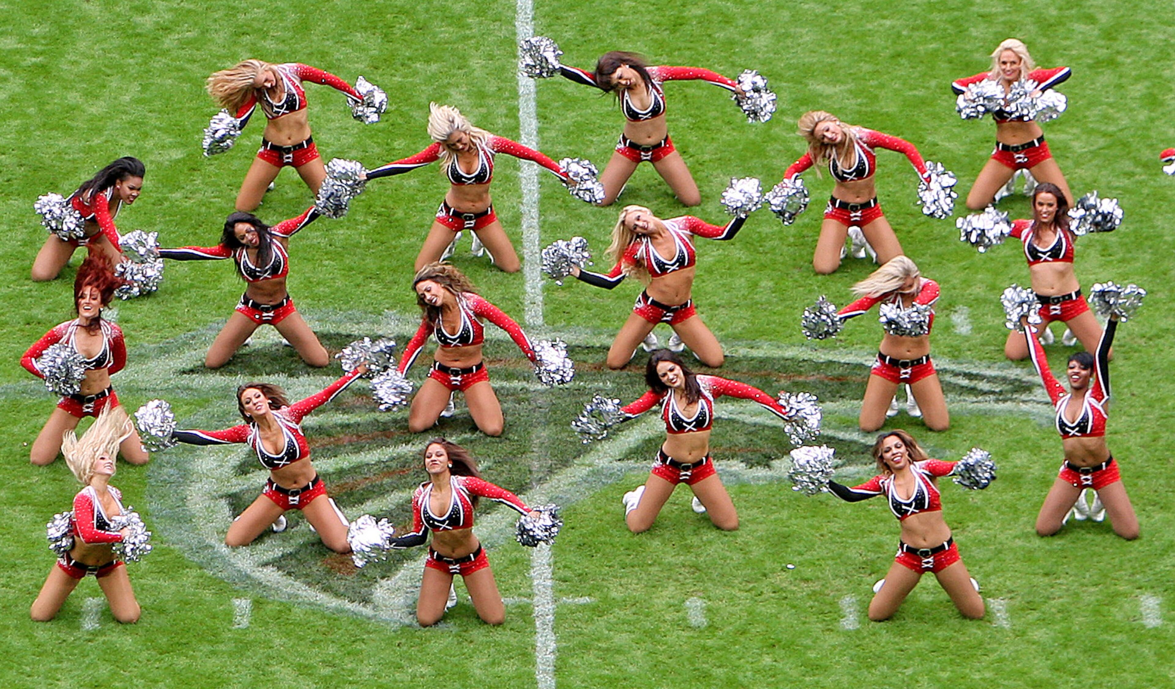 In this handout image made available by NFL UK, cheerleaders perform before the NFL football game between Detroit Lions and Atlanta Falcons at Wembley Stadium, London, Sunday, Oct. 26, 2014. (AP Photo/Nicky Hayes, NFL UK)