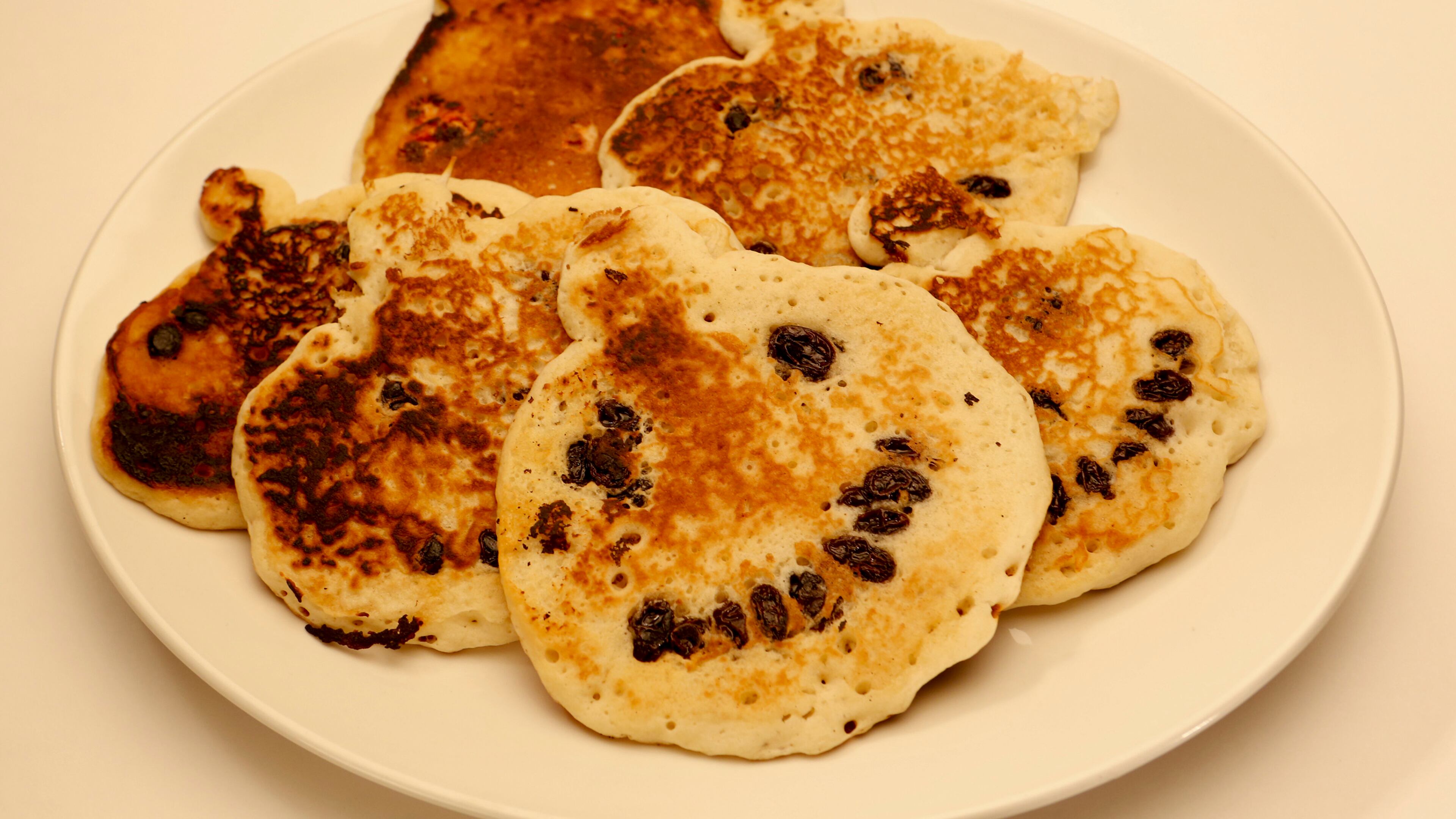 Instead of pouring round pancakes, whip up pumpkin-shaped oval cakes with a little extra batter at the top to form the stem. Use fruit, chocolate or nuts to give each pumpkin-shaped cake a cute -- or frightful -- face. (Anne Cusack/Los Angeles Times/MCT)