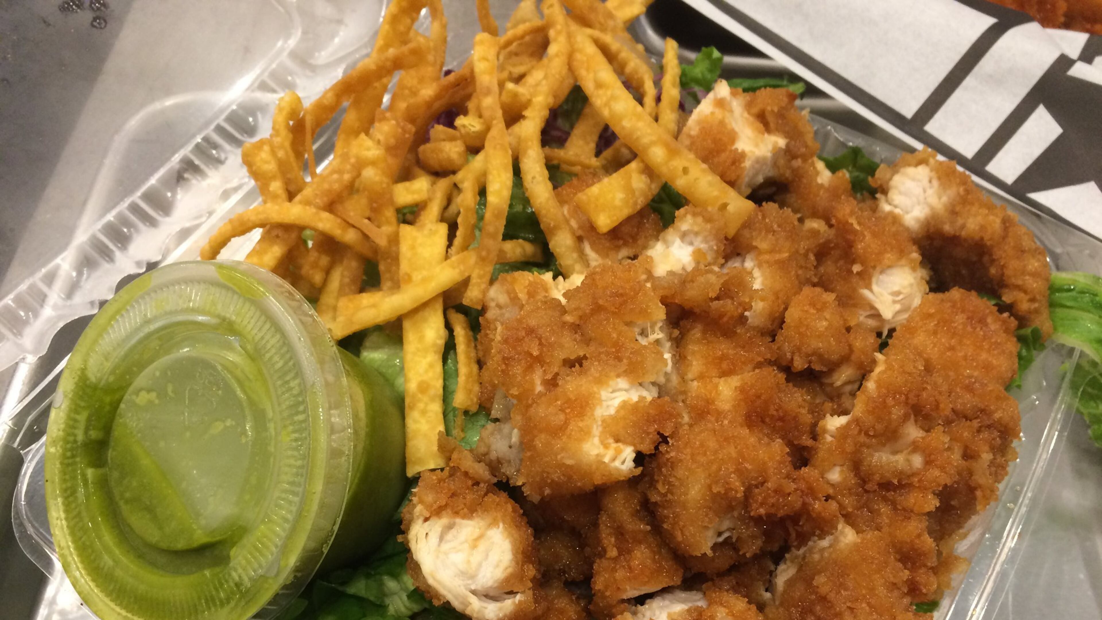 Ponko Chicken’s meal-size salad comes with choice of protein and dressing and is shown here with chopped original chicken tenders and the walnut-cilantro salad. CONTRIBUTED BY WENDELL BROCK