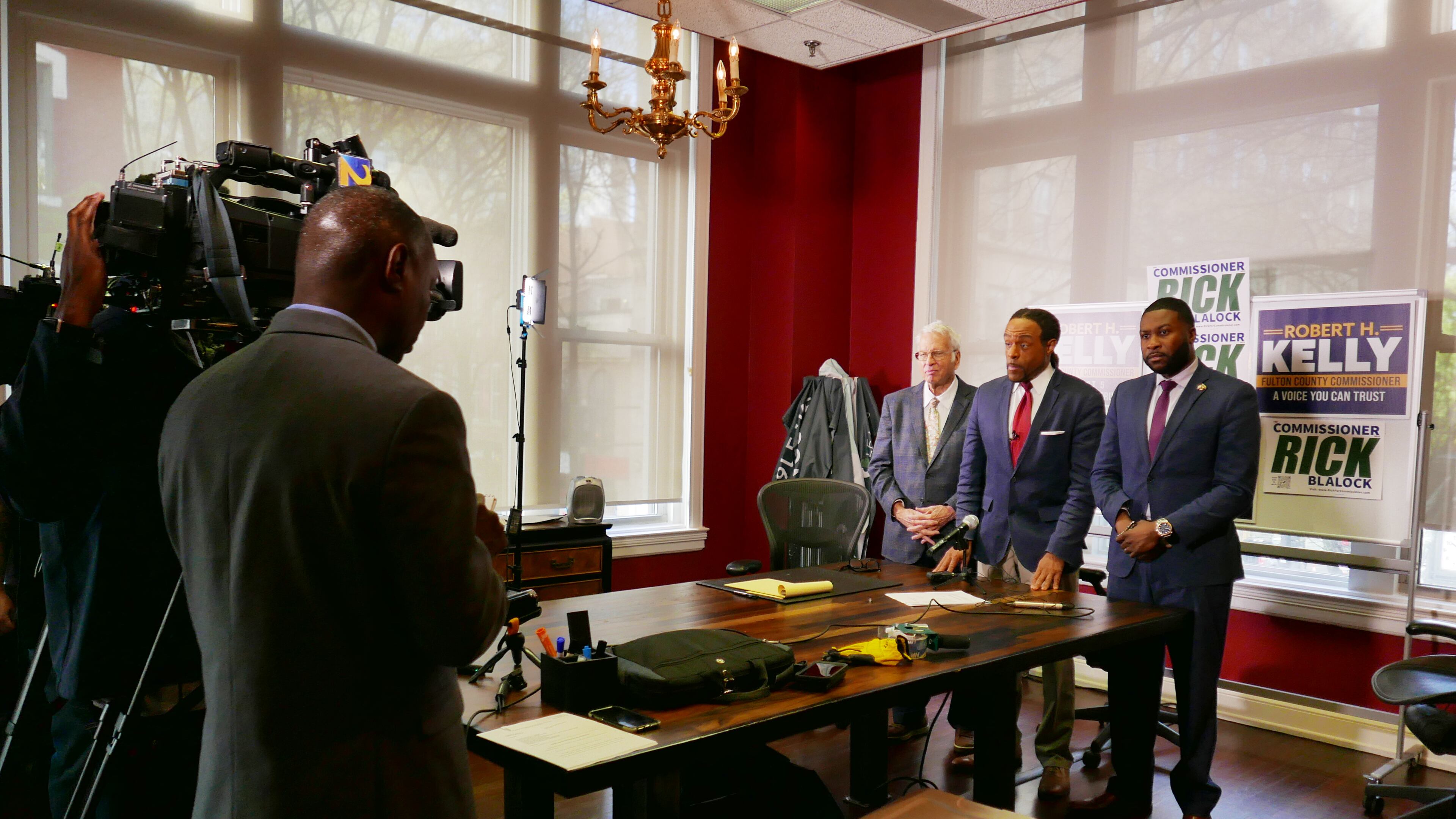 Attorney David Betts, Rick Blalock and Robert Kelly at a press conference on Friday.