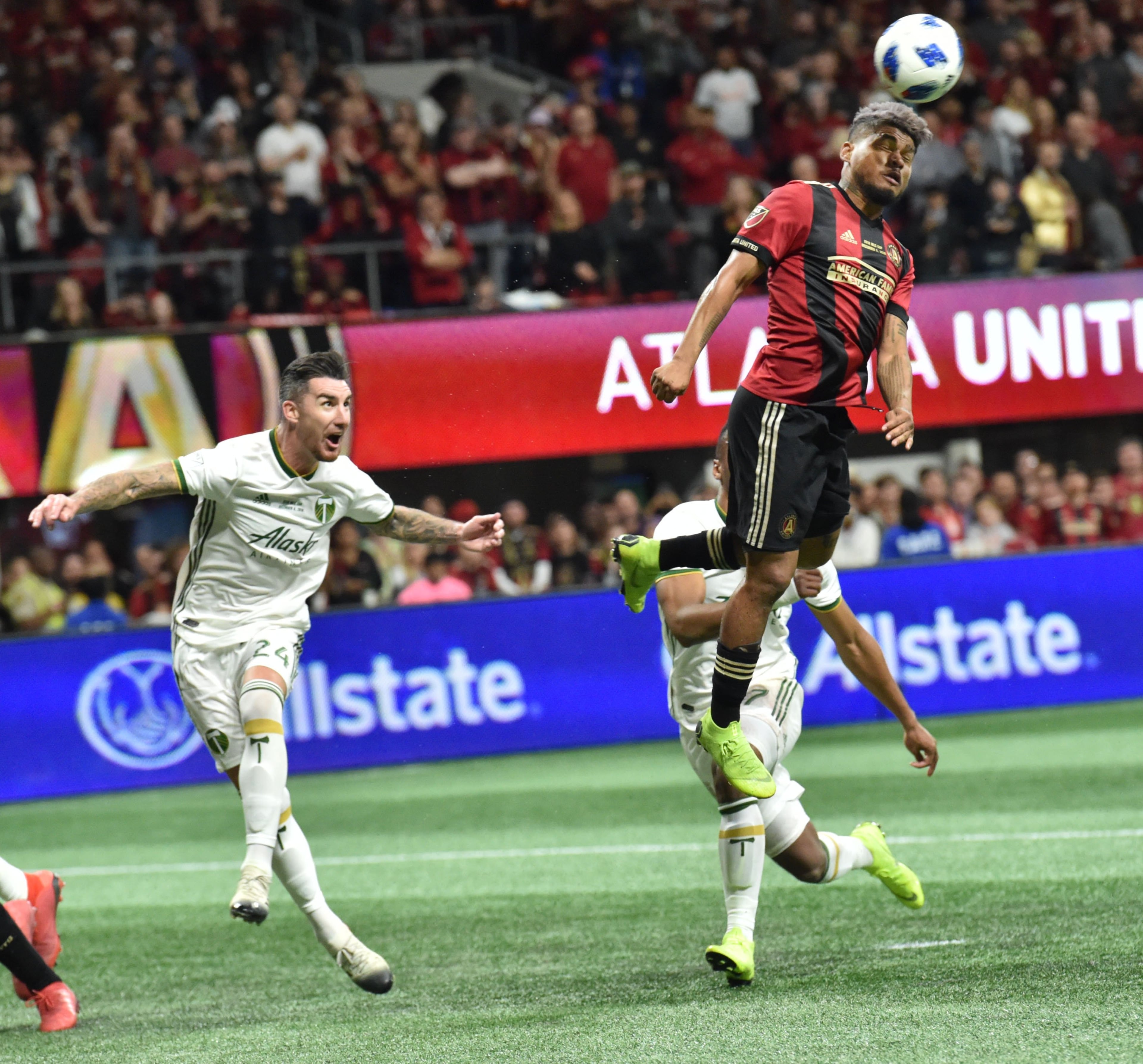Atlanta United forward Josef Martinez goes high in scoring a goal. HYOSUB SHIN / HSHIN@AJC.COM