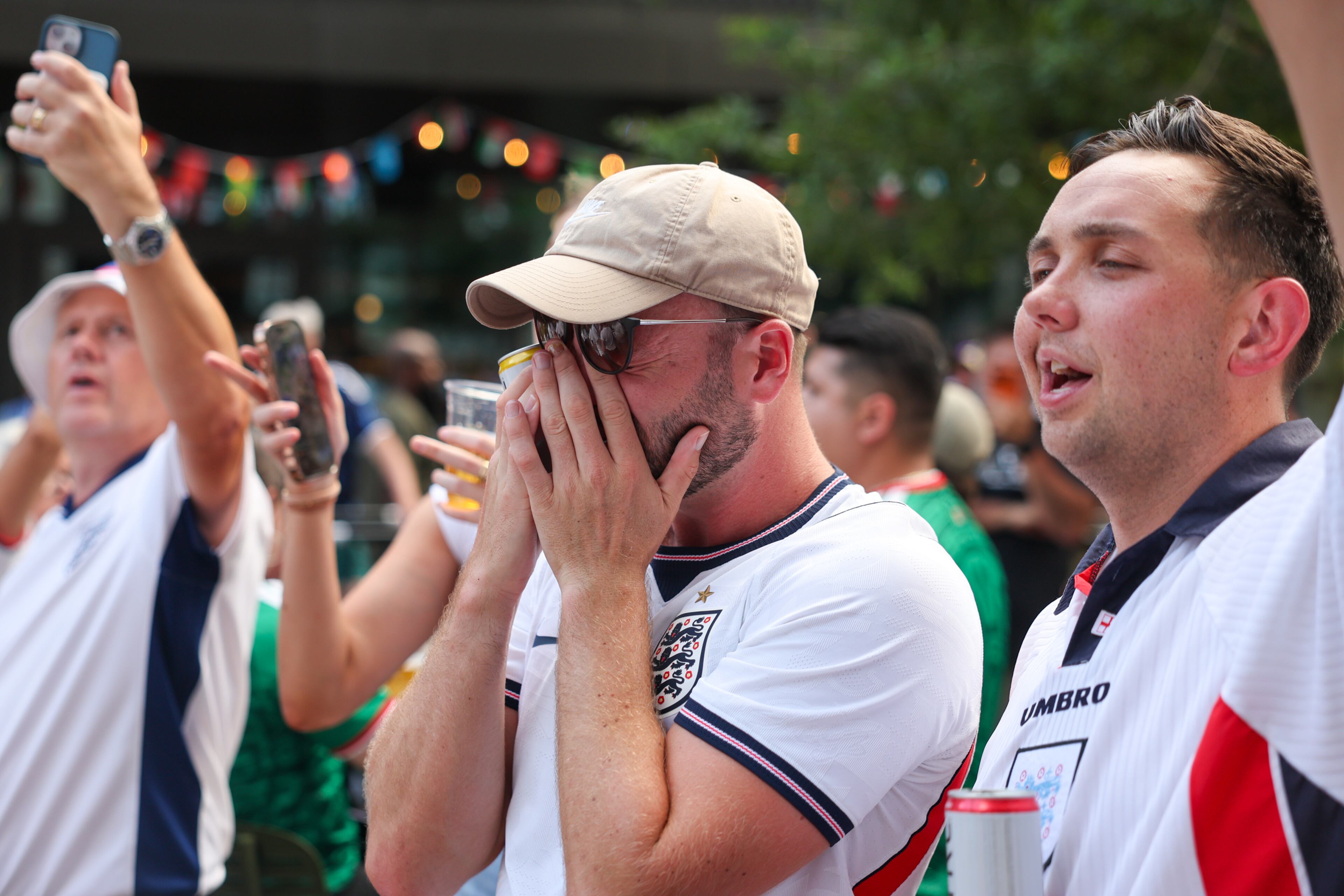 An England fan becomes emotional as others sing Hey Jude in defeat at Irish Exit after Argentina wins the FIFA World Cup game between England and Argentina in Atlanta on July 15, 2026. It’s the last game Atlanta is hosting. Argentina won 2-1. (Arvin Temkar/AJC)