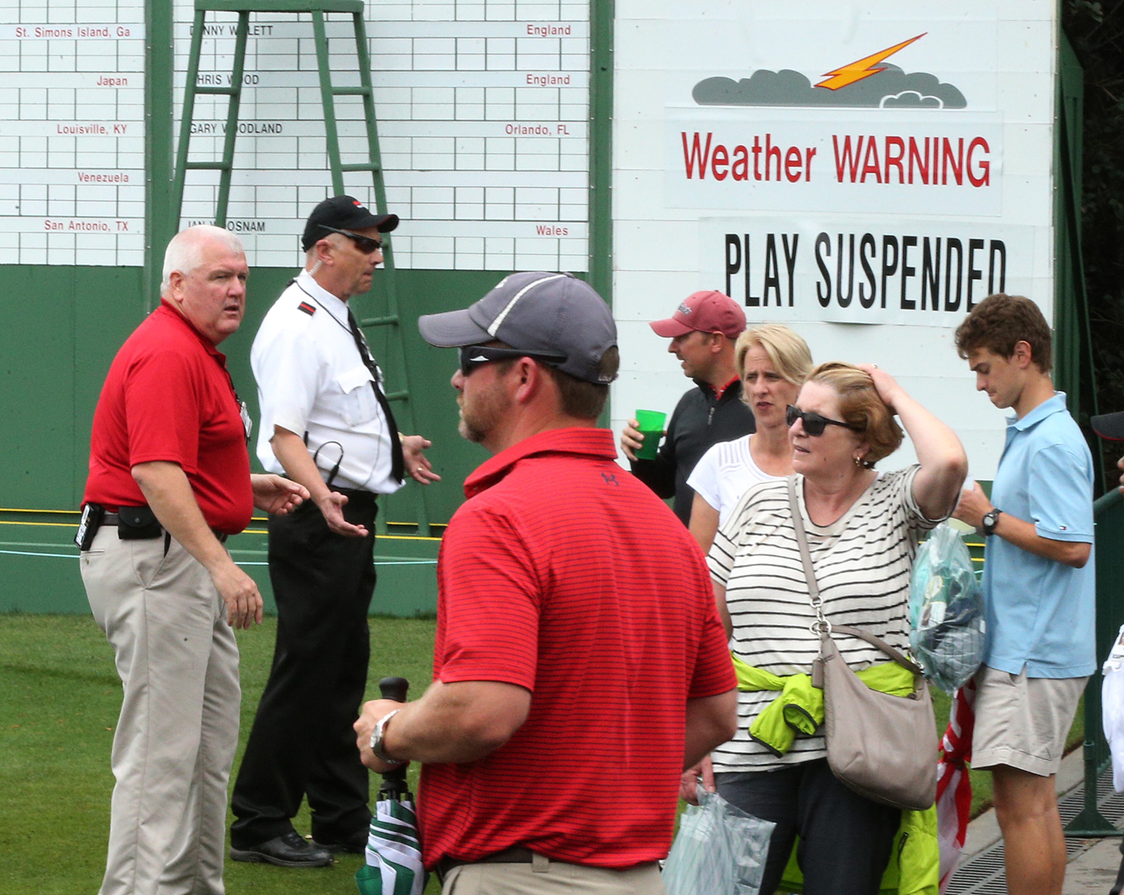 April 3, 2017, Augusta: Under a tornado watch security guards clear patrons from the grounds with play suspended for the day during the Masters at Augusta National Golf Club on Monday, April 3, 2017, in Augusta. Curtis Compton/ccompton@ajc.com