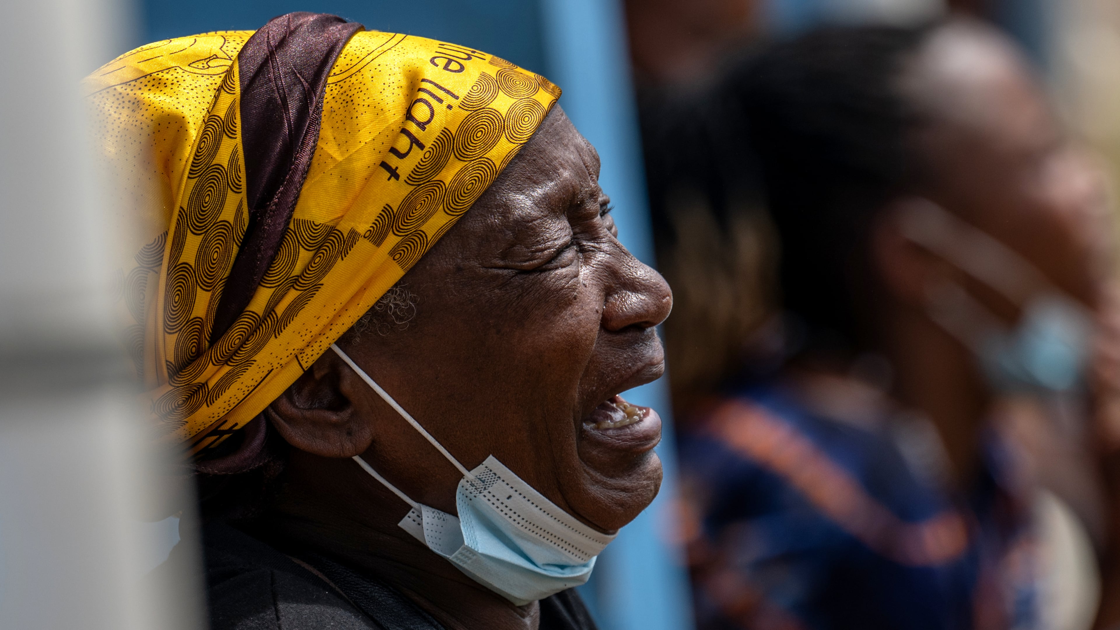 A woman mourns her child, who died of Ebola, at the General Hospital in Bunia, Congo, Thursday, May 21, 2026. (AP Photo/Moses Sawasawa)
