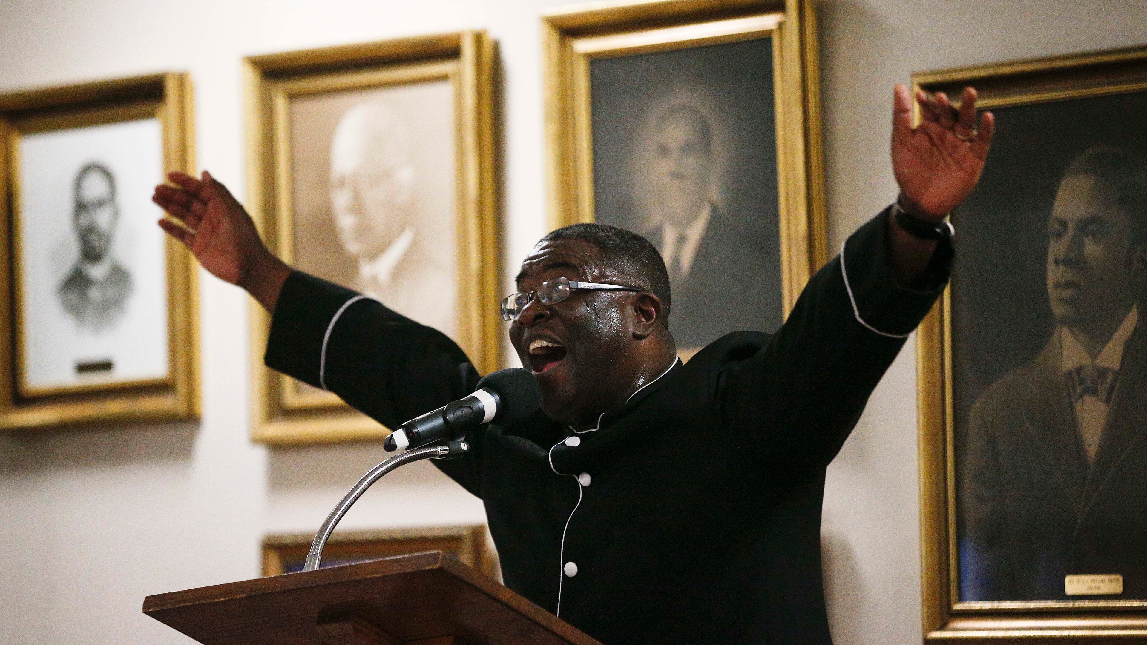 The Rev. Arthur Price Jr., preaches during a 16th Street Baptist church service in Birmingham on Sunday -- telling the mostly black congregation that Alabama's U.S. Senate election was too important to skip. AP/Brynn Anderson
