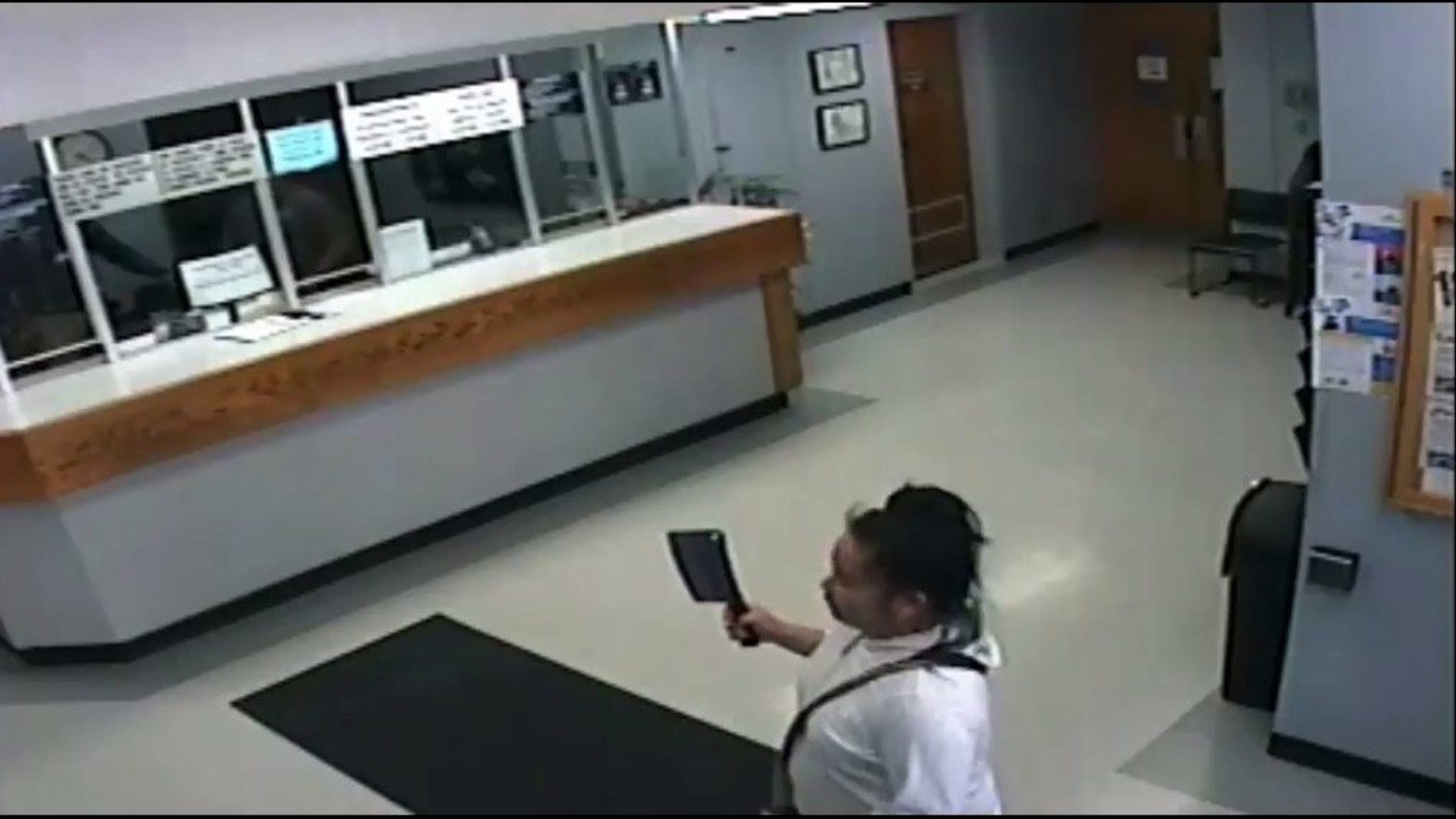 Police say woman armed with a cleaver took another woman hostage in the Salinas Police Department lobby.