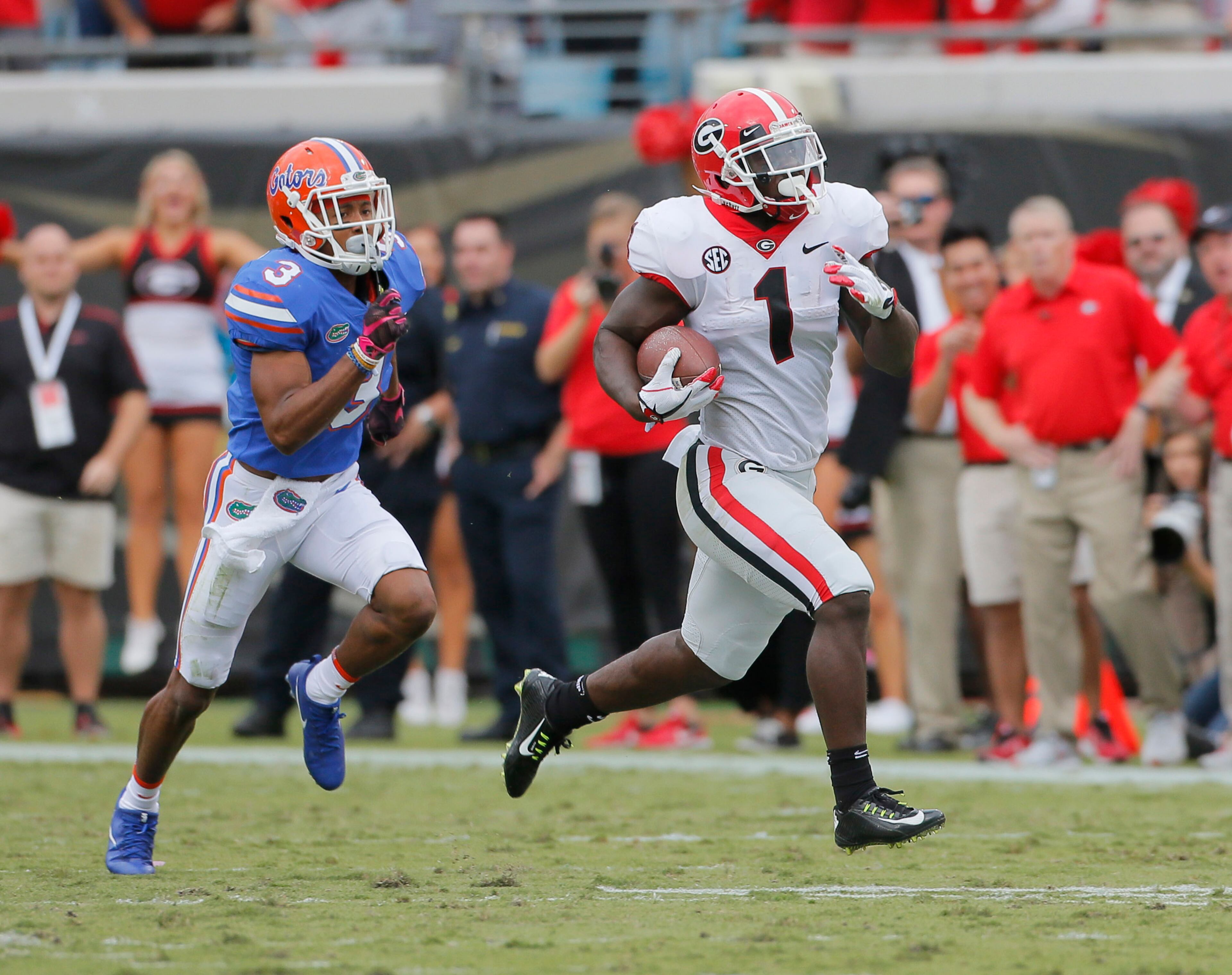 10/28/17 - Jacksonville, FL - Georgia Bulldogs running back Sony Michel (1) breaks free to score Georgia's third TD in the first quarter. NCAA football game between Georgia and Florida at EverBank Field in Jacksonville. BOB ANDRES /BANDRES@AJC.COM